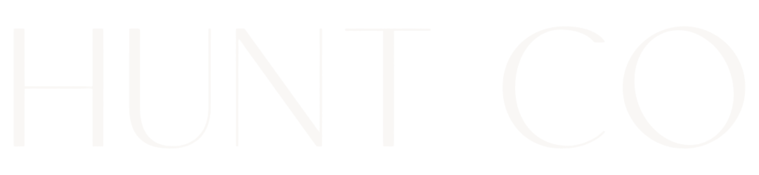 Close-up of text reading 'HUNT CO' on a black background.