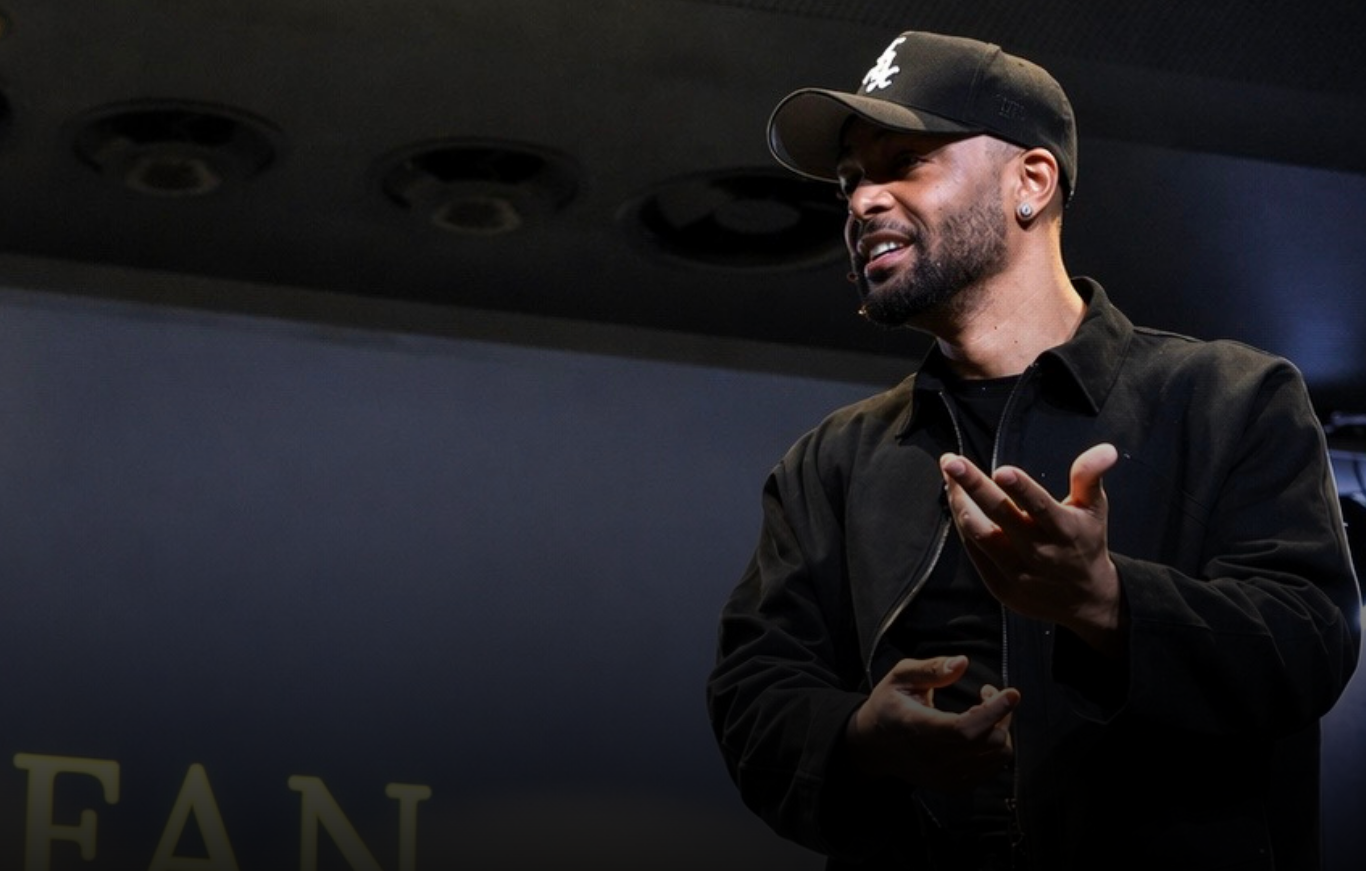 Stefan Saunders speaking on stage during a transformational keynote