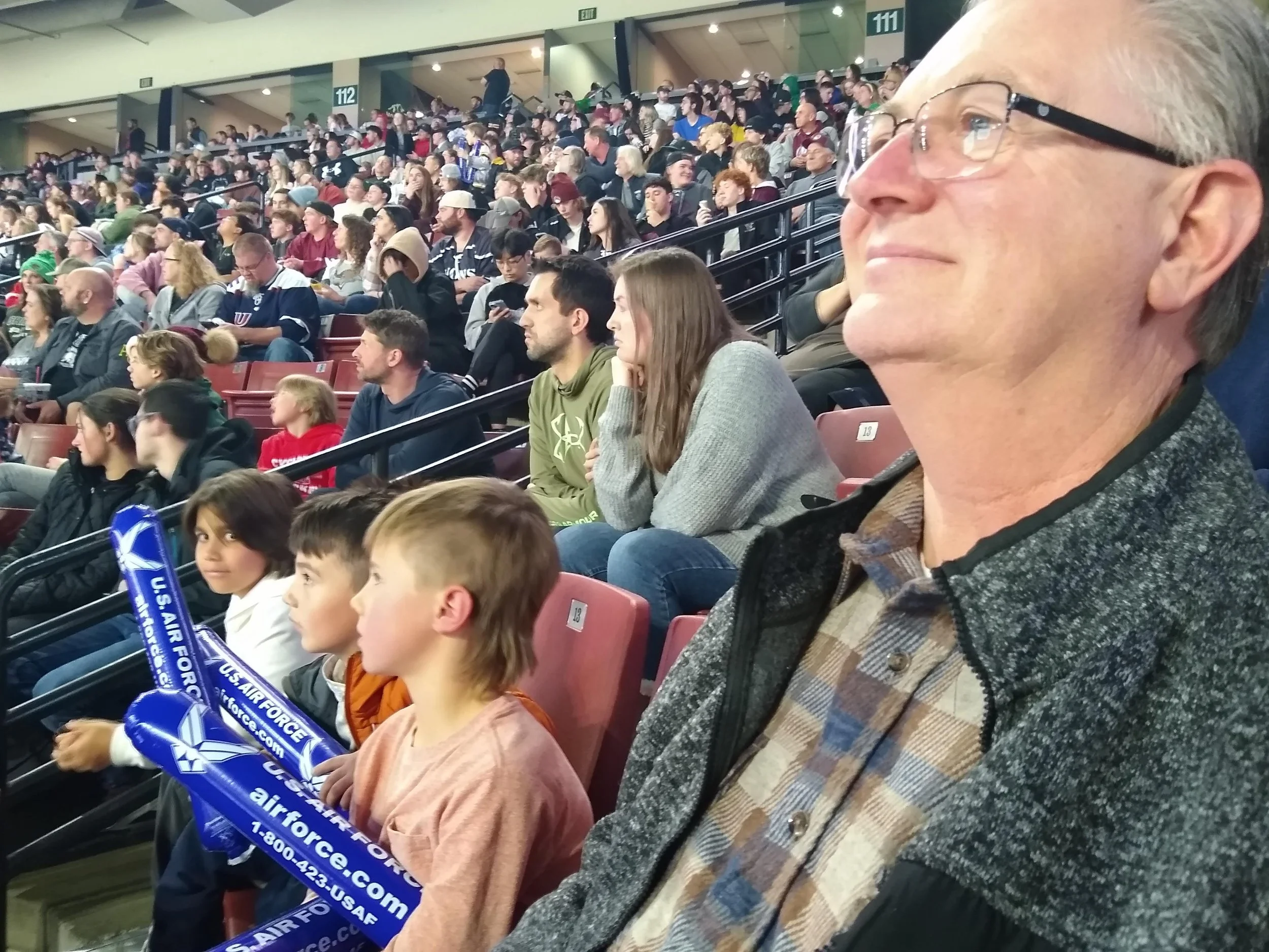 Michael Finch and his grandchildren at a Grizzlies game.