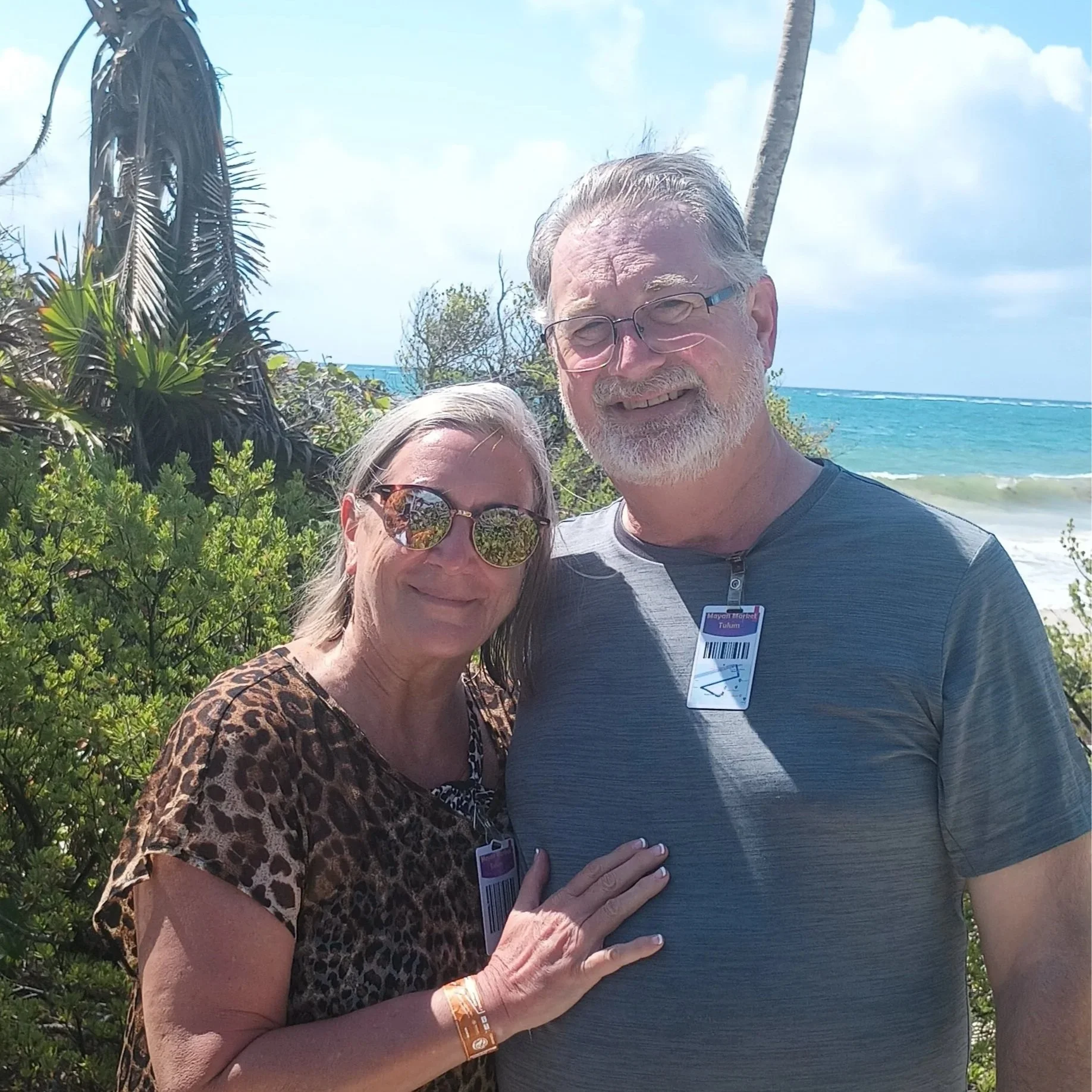 Michael Finch and his wife on a beach.