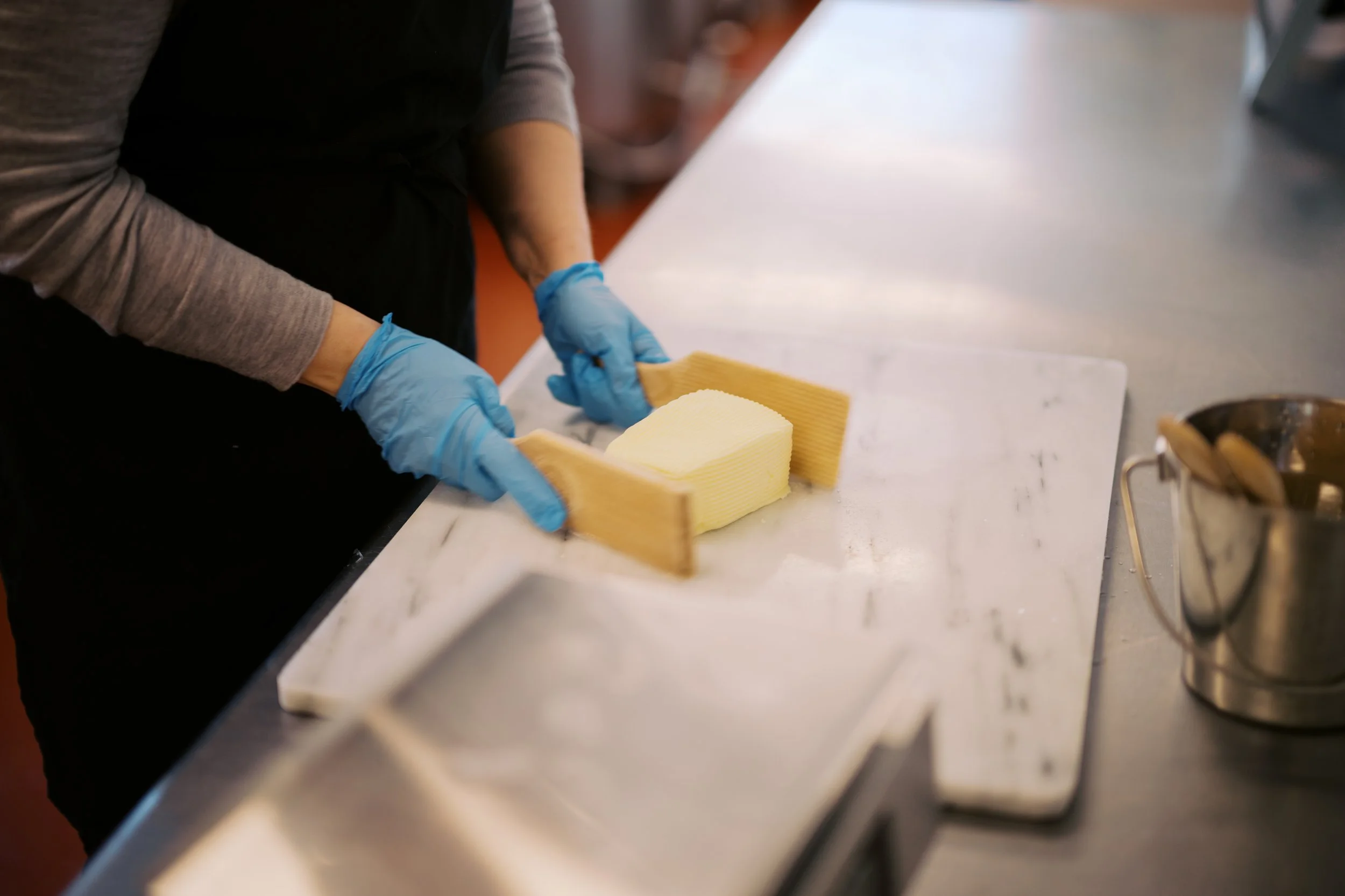 Landmark Creamery Butter being molded on a marble table