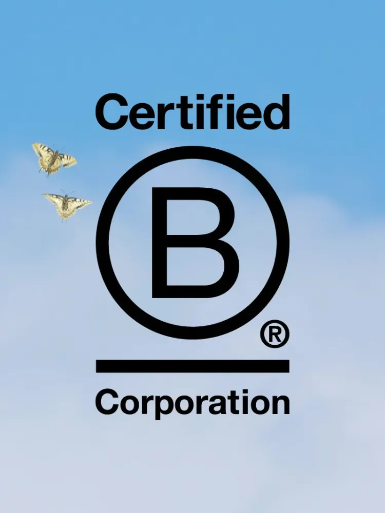 Certified B Corporation logo against a blue sky with two butterflies