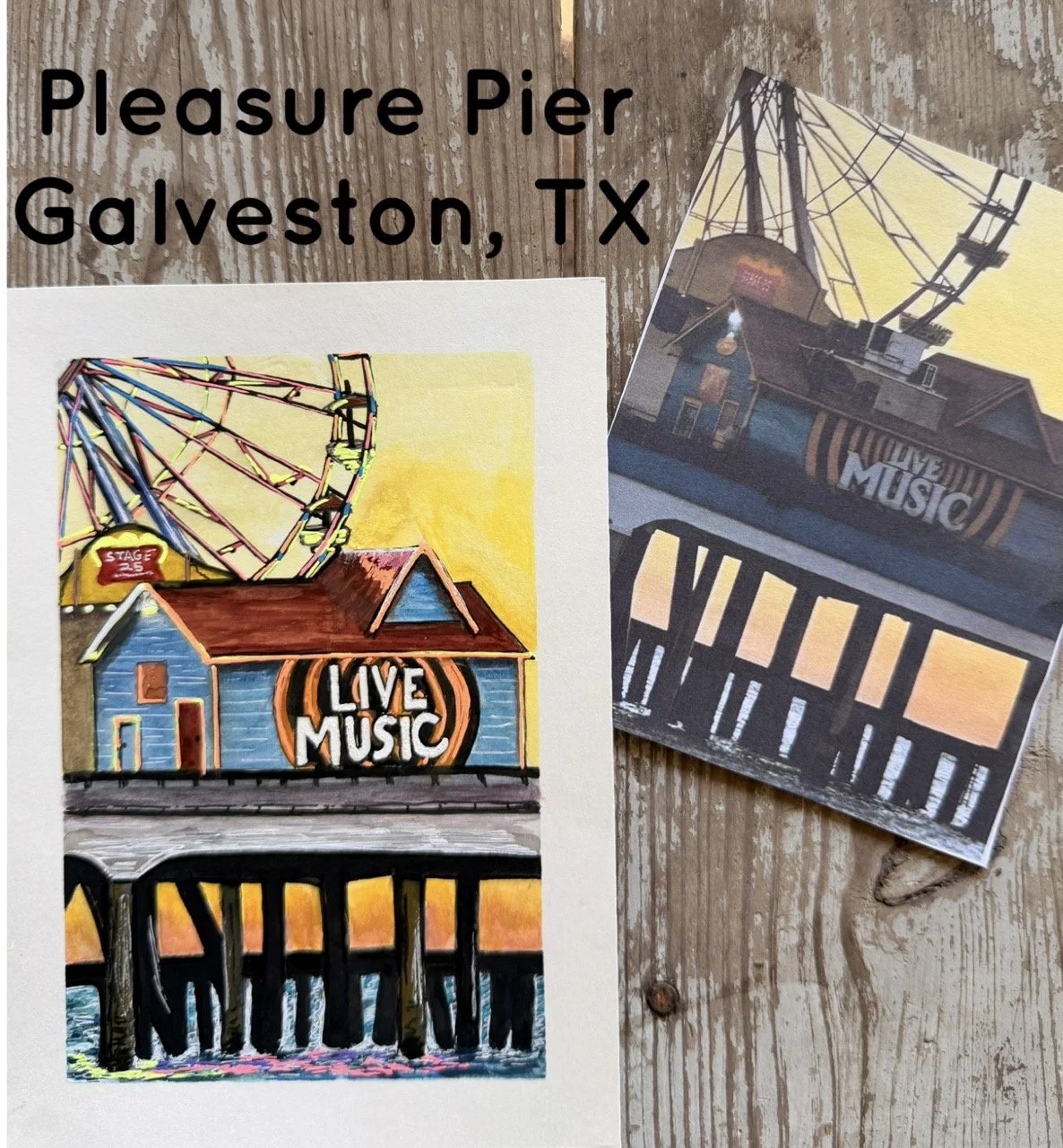 Colorful illustration of a small building labeled 'Live Music' with a roller coaster in the background, and a black fence at the bottom, all on a wooden surface.