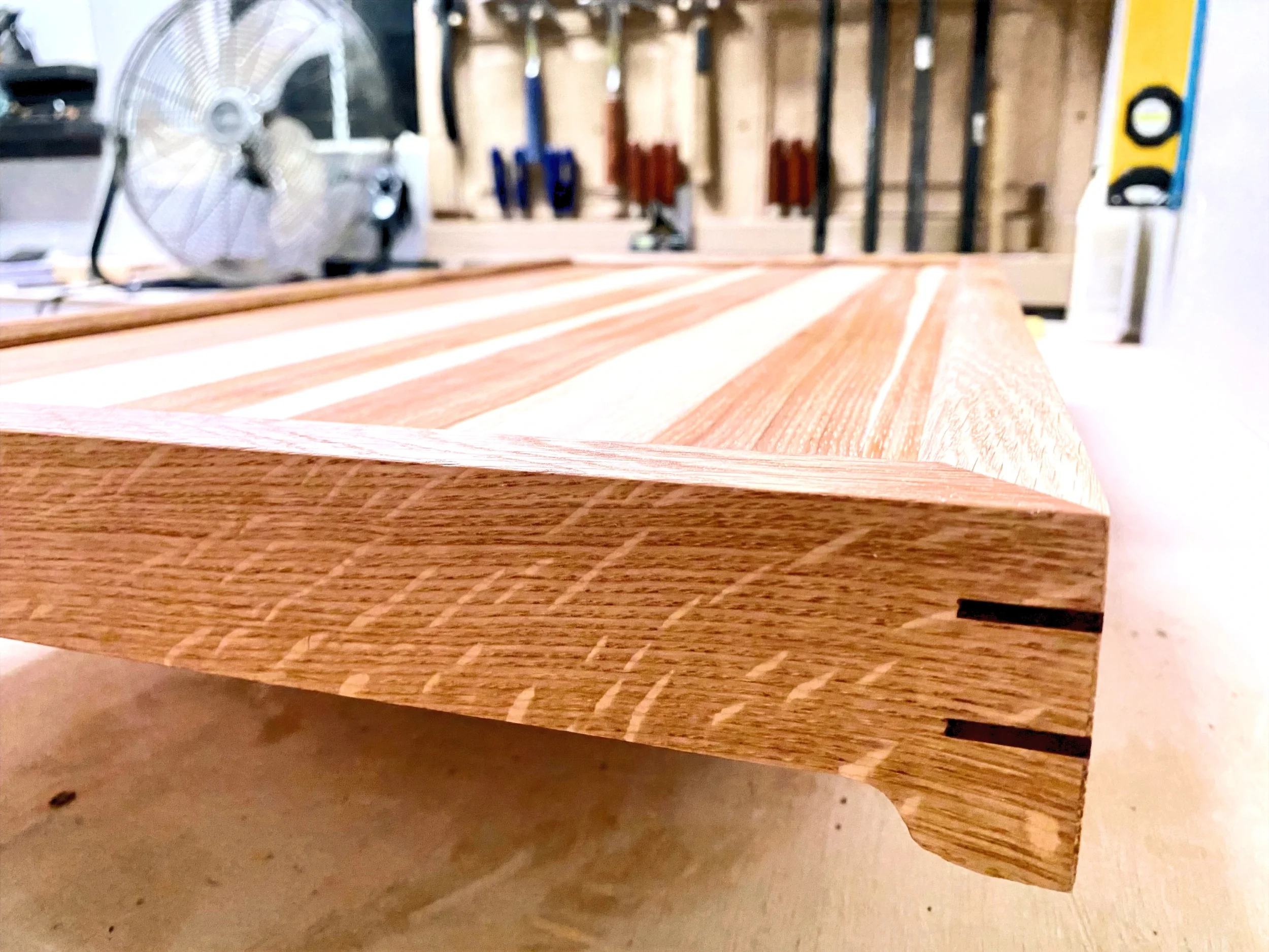 custom serving tray with oil finish on workbench
