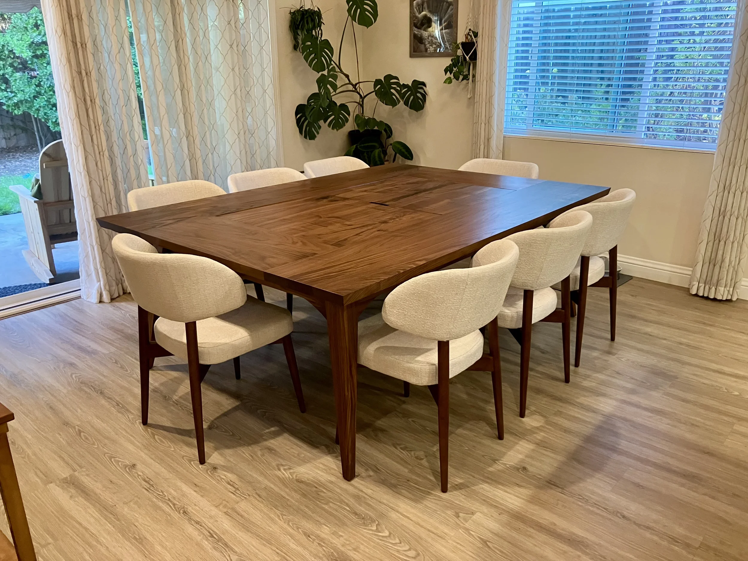 custom walnut hardwood dining table with recessed gaming table below