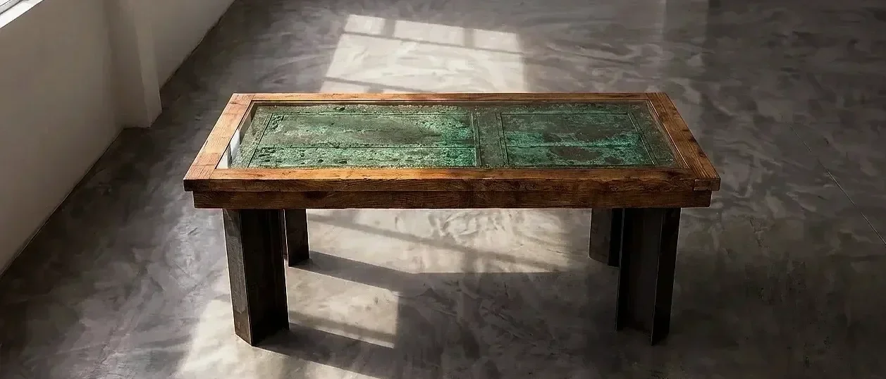 bespoke dining table made with reclaimed materials such as pine, steel and architectural door