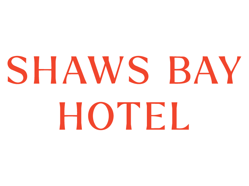 Stylized black and green sign with the text "Shaws Bay Hotel" in bold font.