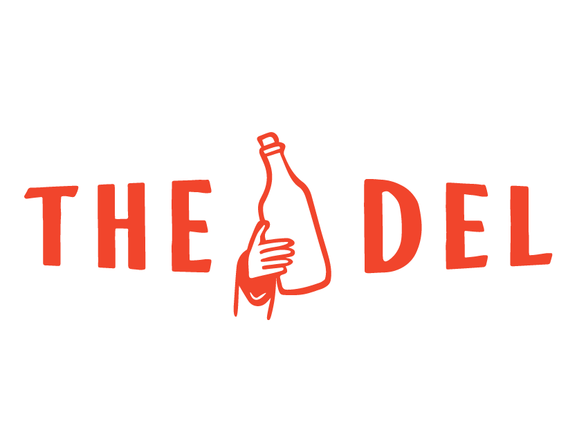 The logo features the words "THE DEL" in uppercase red letters, with a hand holding a bottle replacing part of the word 'THE'.