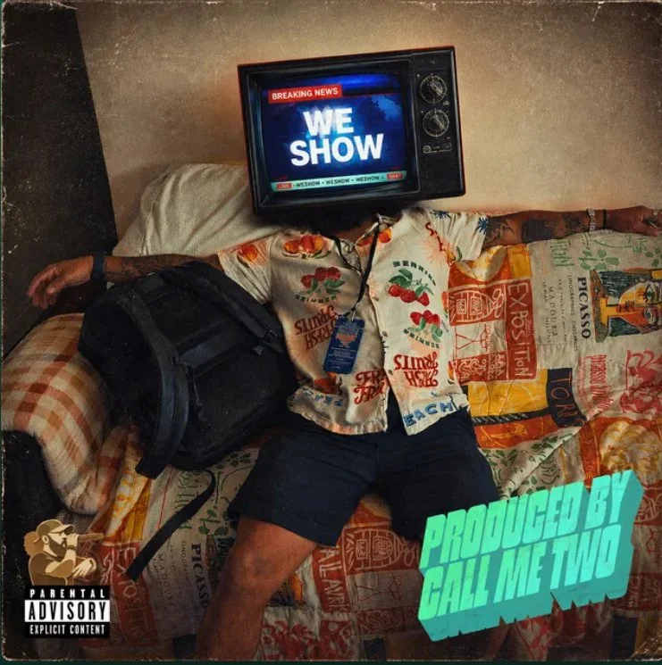 Person laying on a bed with a television on their head displaying news, wearing summer shirt, shorts, with a black bag beside them, and text overlay reads "Produced by Call Me Two". Parental advisory label in corner.