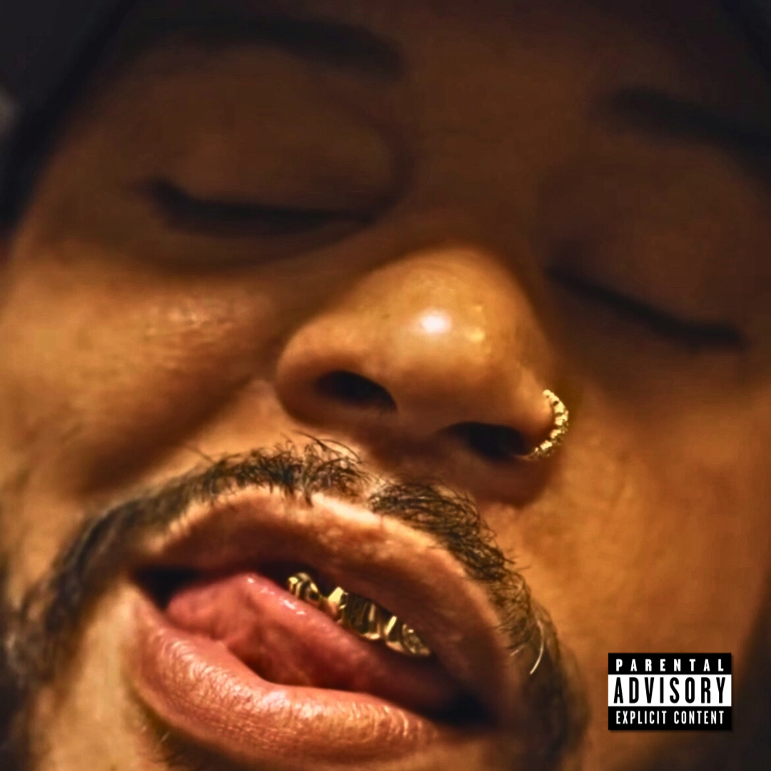 Close-up of a man's face with closed eyes, gold nose ring, facial hair, and visible gold teeth, with a Parental Advisory label in the bottom right corner.