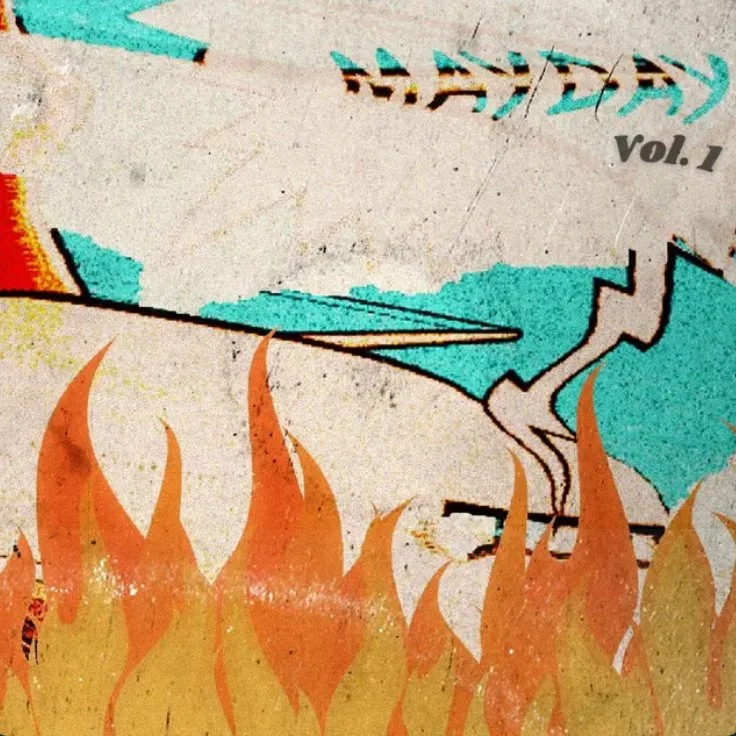 Graffiti art on a wall featuring flames, a blue shape, and text that reads 'HAYEAY,' with 'Vol. 1' written nearby.