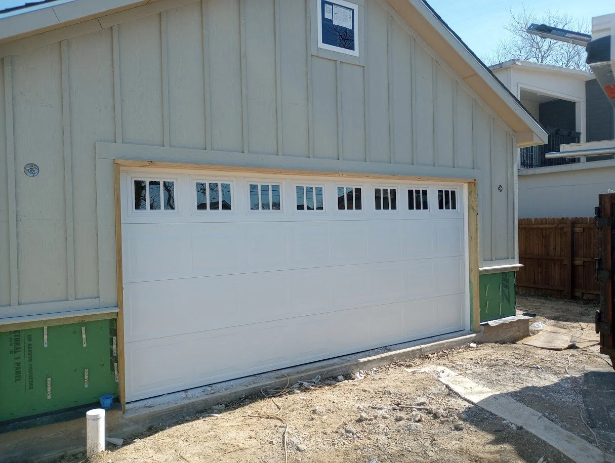 white 16x7 garage door with eight windows.