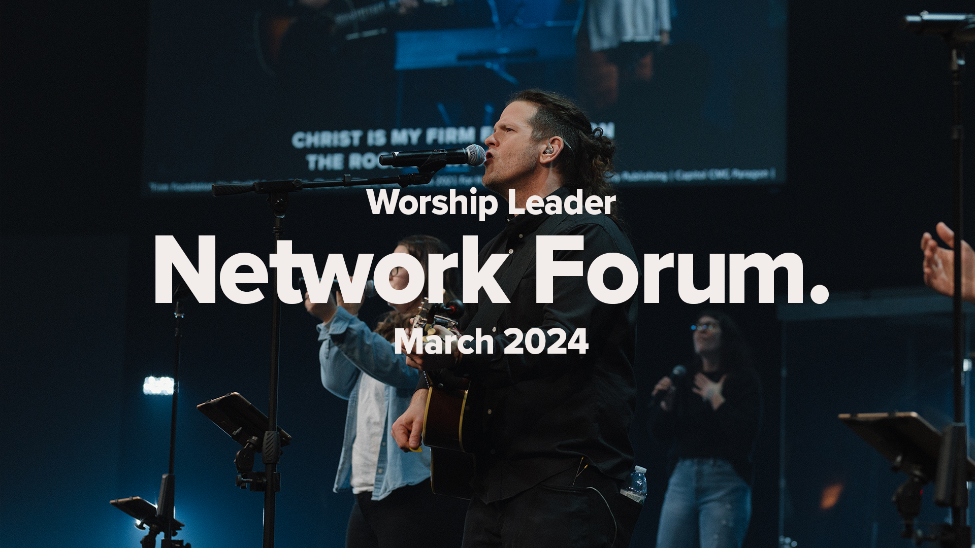 Singer at Mic with singer behind clapping. Worship Leader Network Forum March 2024 Promotional letters