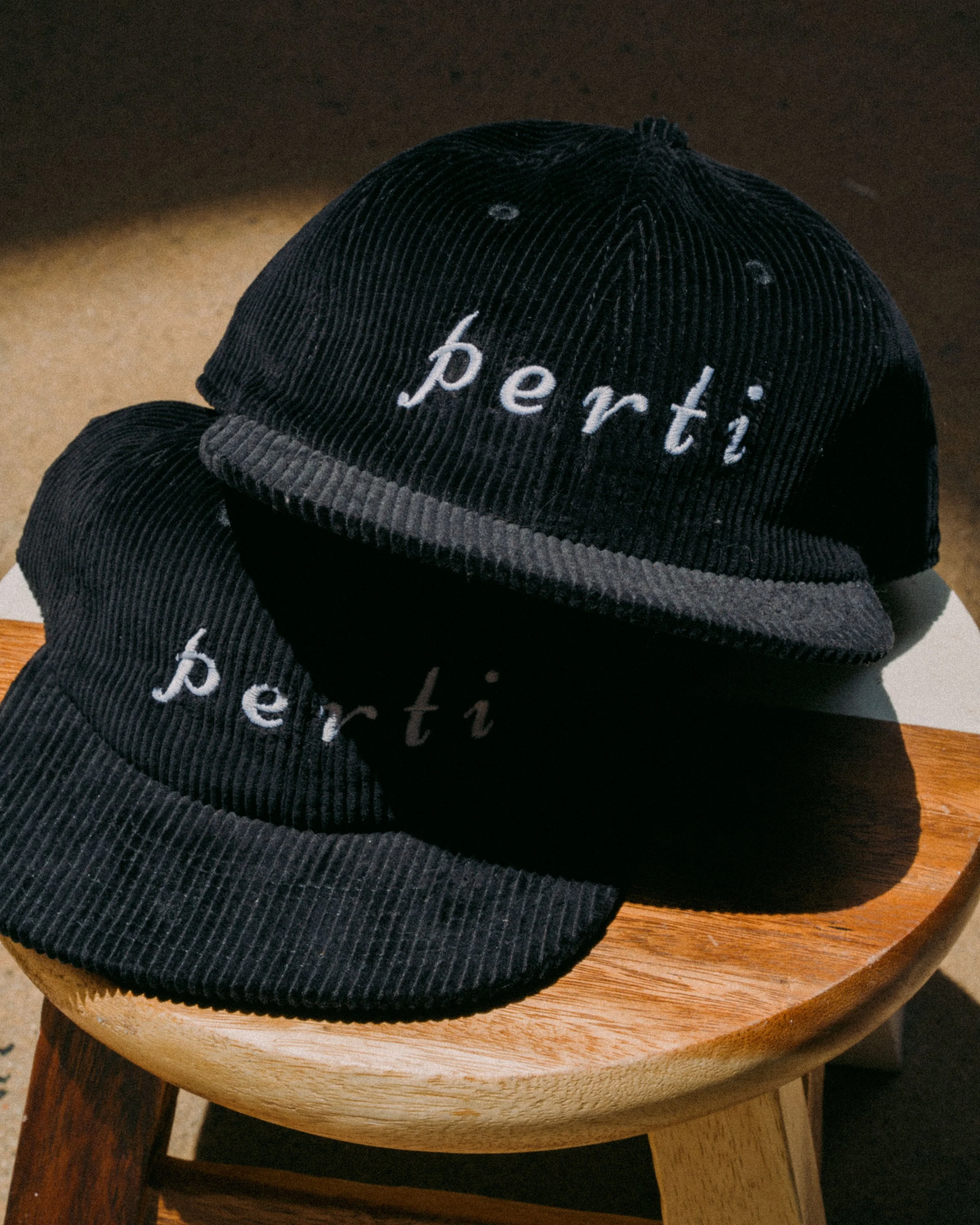 perti black corduroy hat