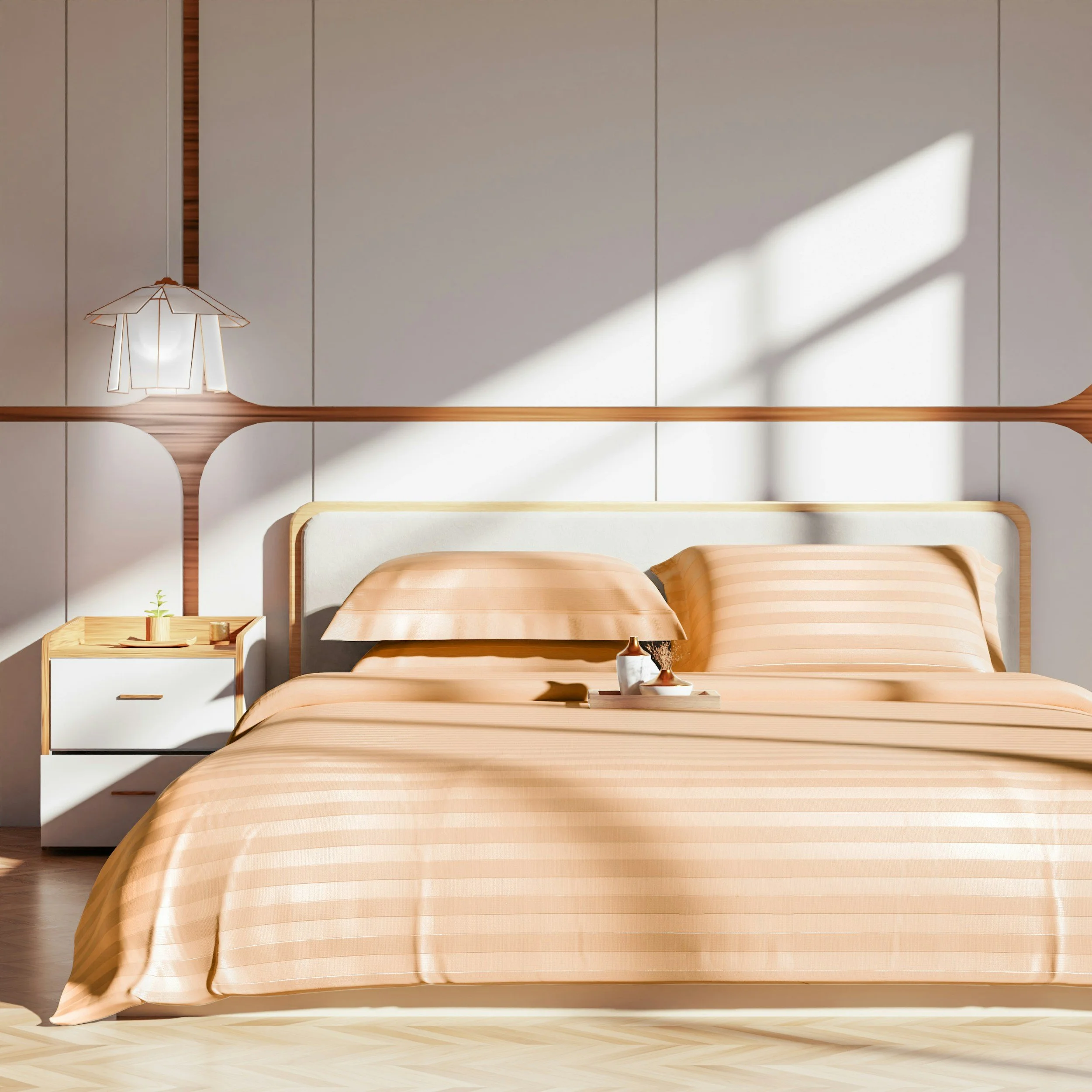 A bedroom with a wooden bed, striped beige and white bedspread, white and wooden nightstand with small decor, a modern lamp with a paper lampshade, white paneled wall with a wooden strip, and sunlight casting shadows on the wall.