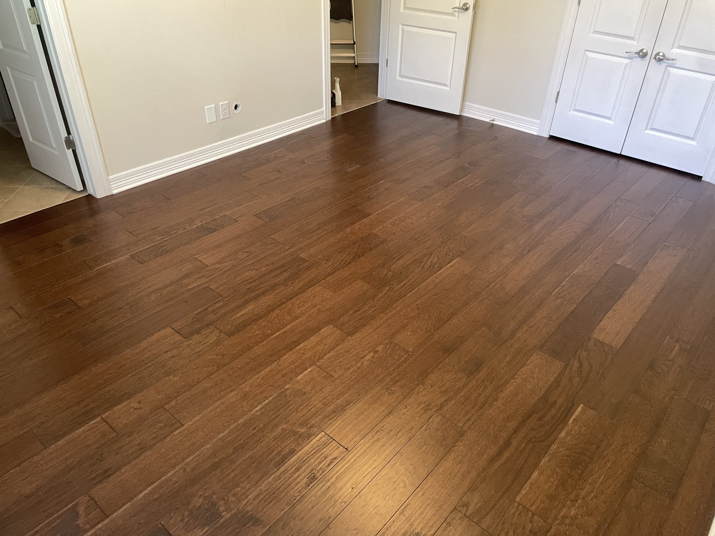 Engineered Wood Flooring Installation – San Antonio

Engineered wood flooring installation in a rich dark brown finish, adding depth and a more refined look to the space. Installed for a smooth, continuous flow across the room with clean transitions.