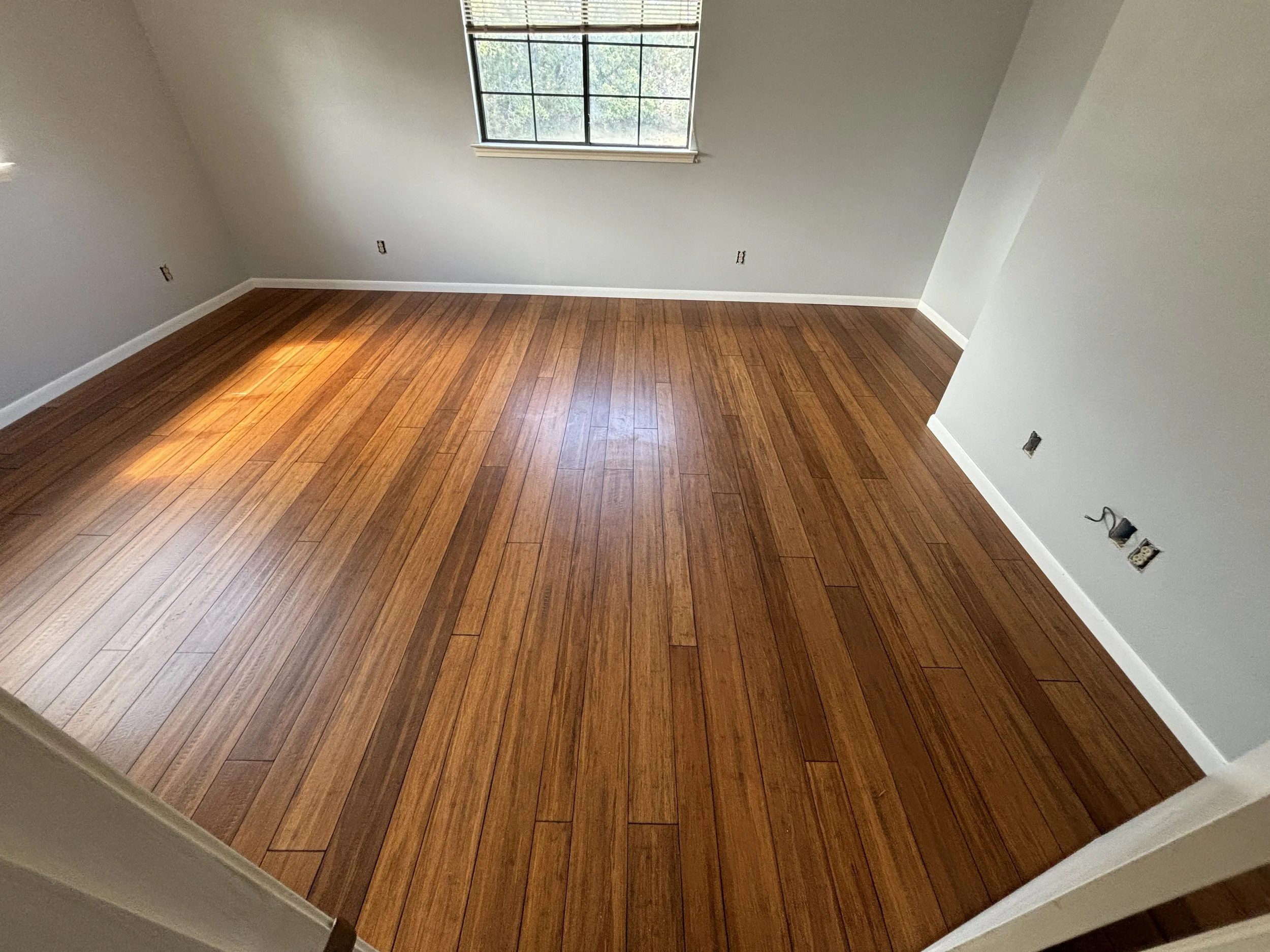 Solid Bamboo Flooring Installation – San Antonio

Solid bamboo flooring installation in a rich natural tone, bringing a clean, modern look with a unique grain pattern. Bamboo is a strong, eco-friendly option that offers durability and a distinctive f