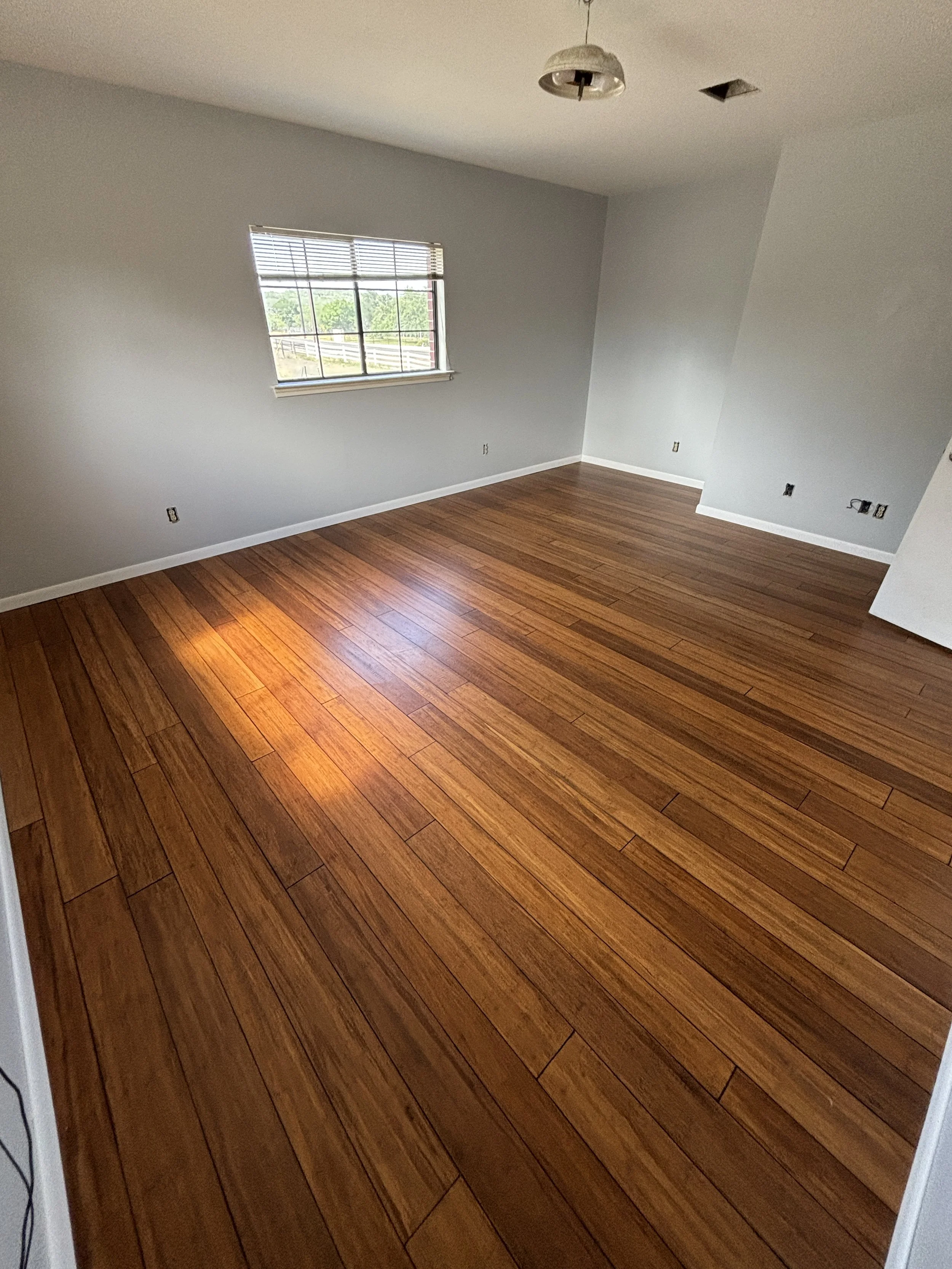 Solid Bamboo Flooring Installation – San Antonio

Solid bamboo flooring installation in a rich natural tone, bringing a clean, modern look with a unique grain pattern. Bamboo is a strong, eco-friendly option that offers durability and a distinctive f