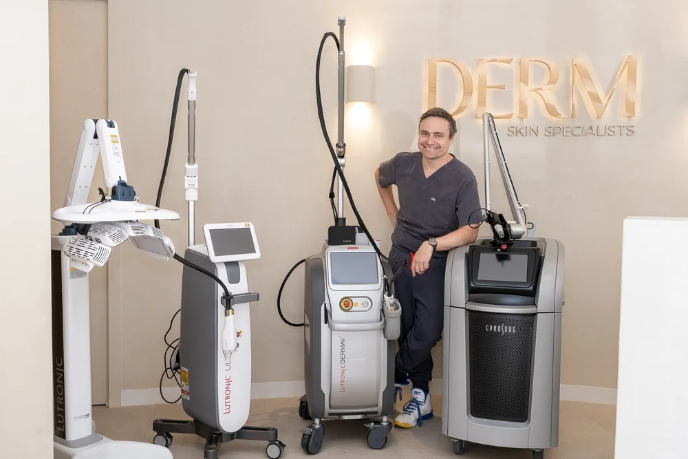 Dr Mitch Robinson, specialist dermatologist, with lasers in the laser suite at DERM Skin Specialists, Mount Gravatt