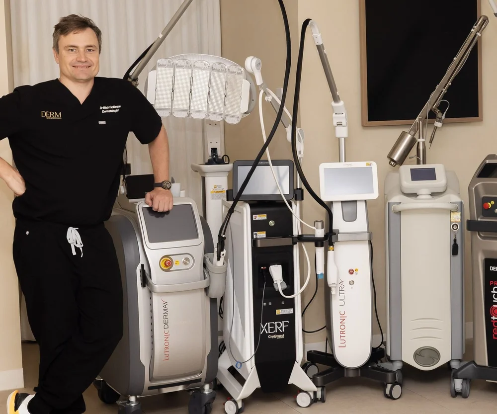 Dr Mitch Robinson beside the XERF device in the laser suite at DERM Skin Specialists, Mount Gravatt
