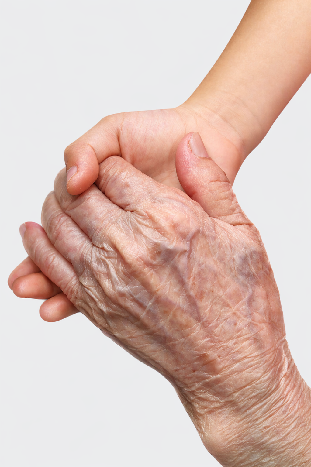 An elderly person's wrinkled hand holding a younger person's smooth hand.