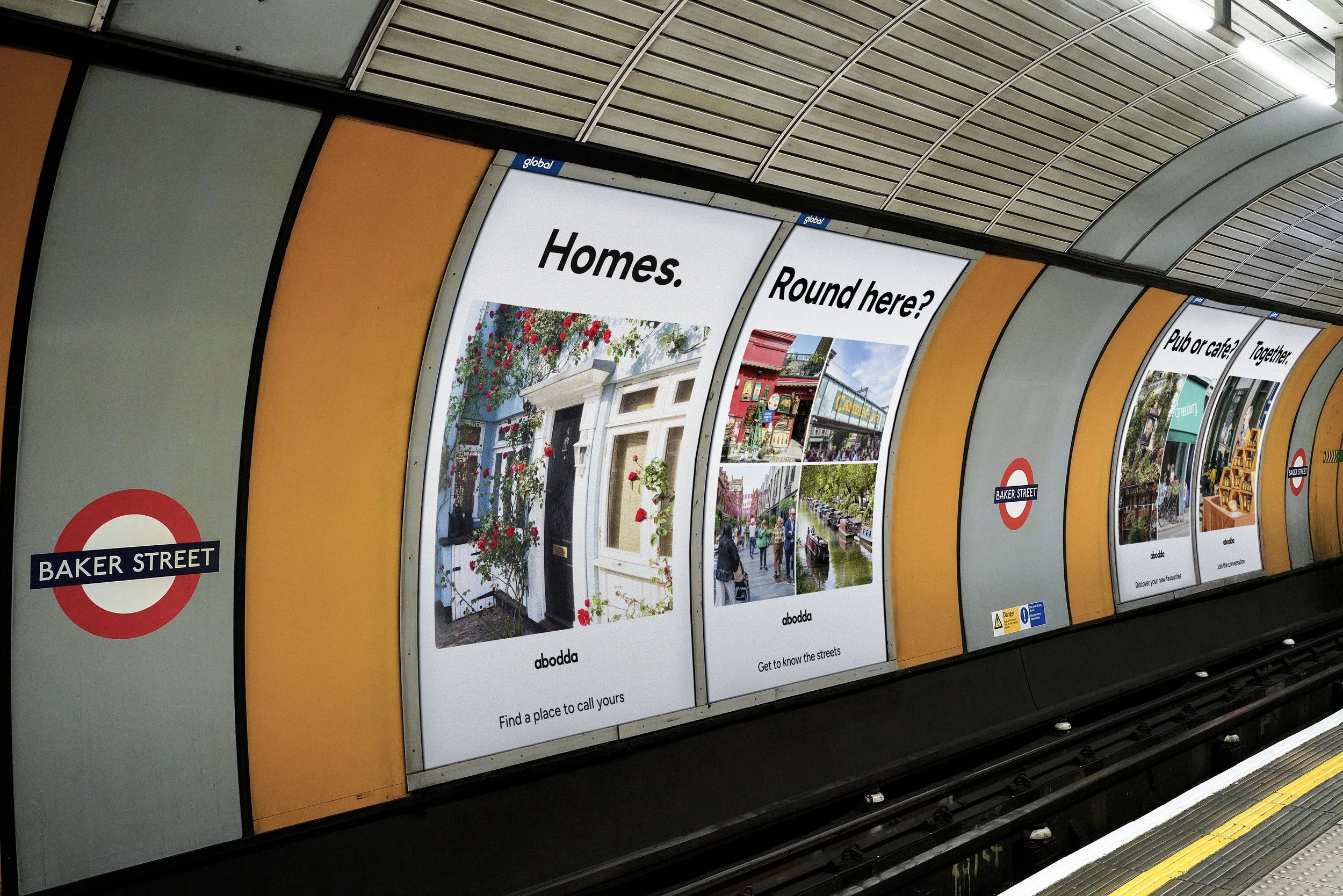 Underground subway station platform with colorful advertisements featuring homes, neighbourhoods, things to do and communities for abodda, including the Baker Street station sign.