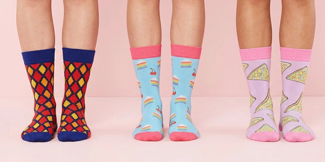 Three pairs of custom dress socks with digitally printed designs