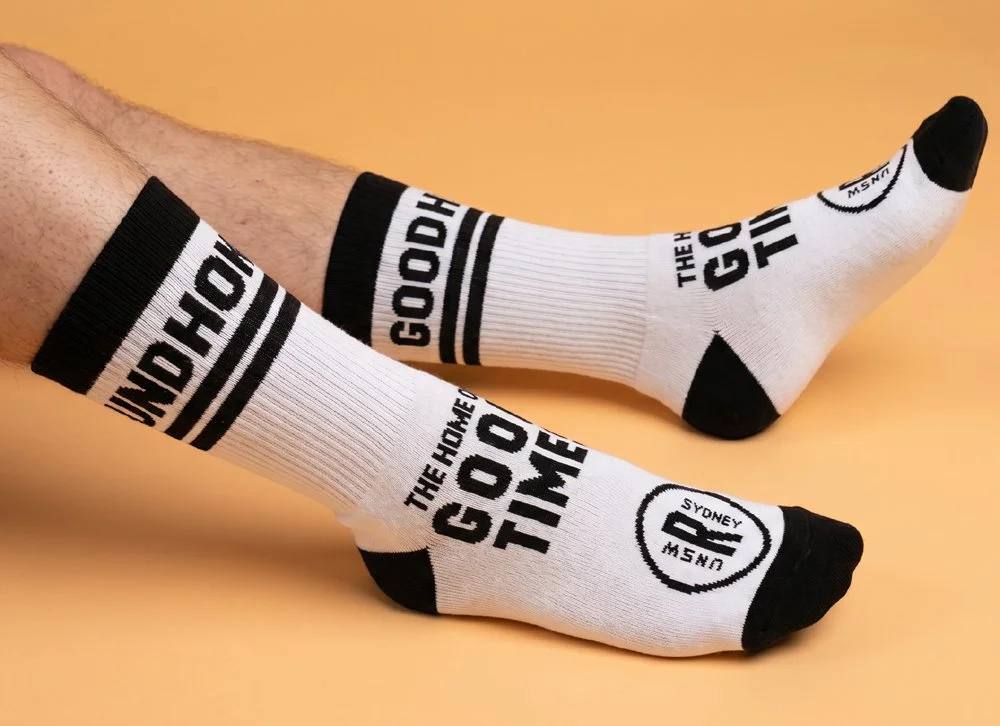 Custom White Sports Socks with UNSW branding