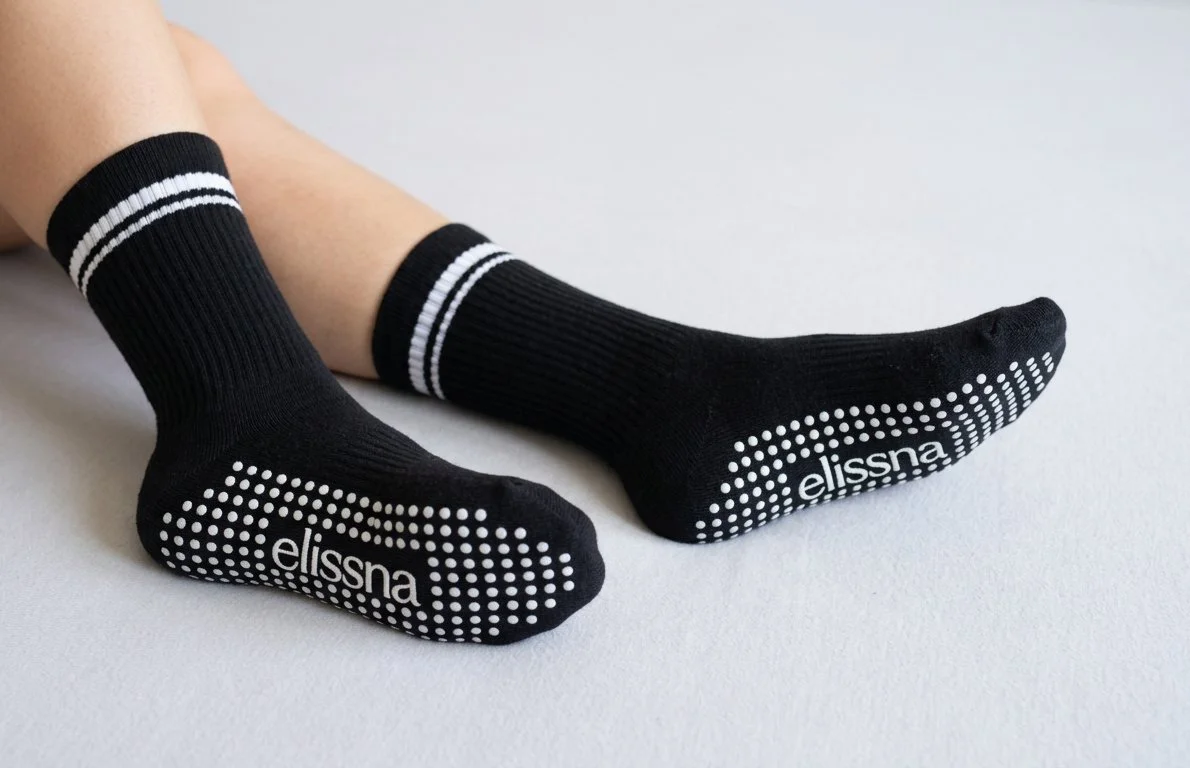 Black sports crew socks with grips on the bottom