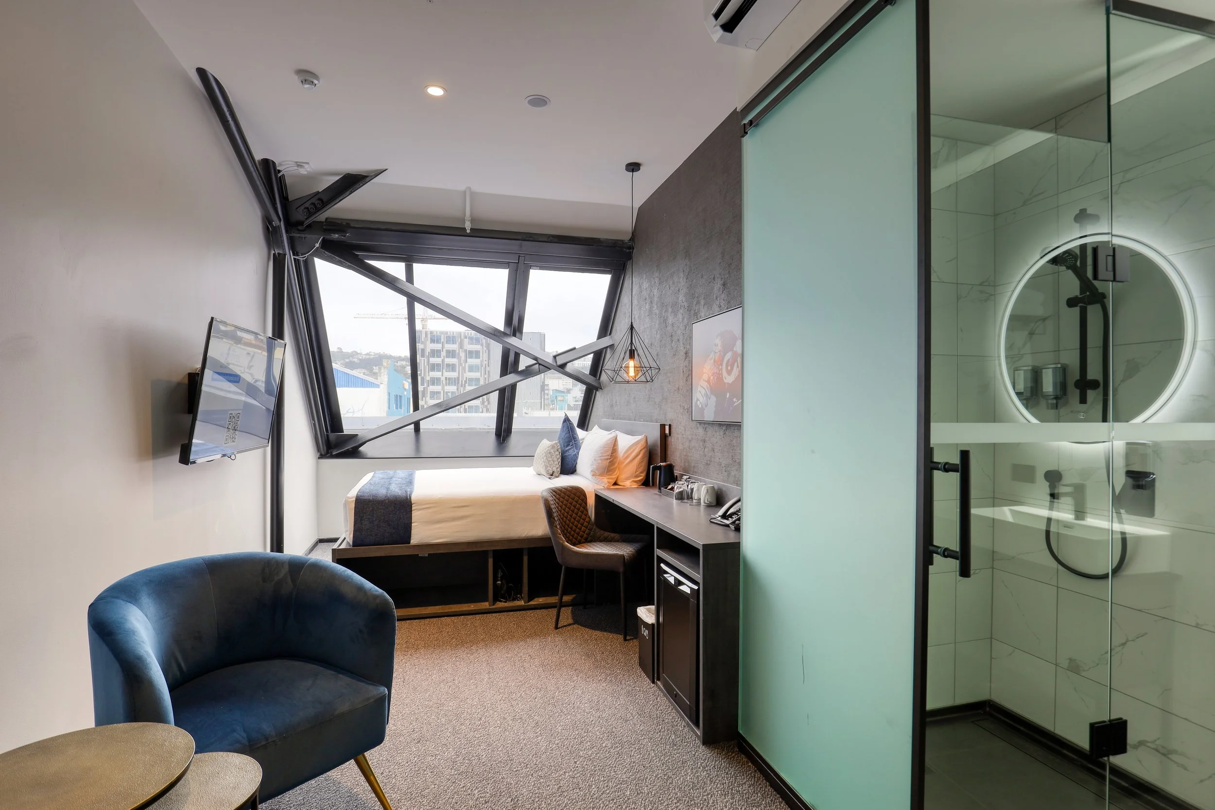 Business Queen Room at The Viv Hotel in Wellington CBD featuring a queen bed, workspace and contemporary furnishings.
