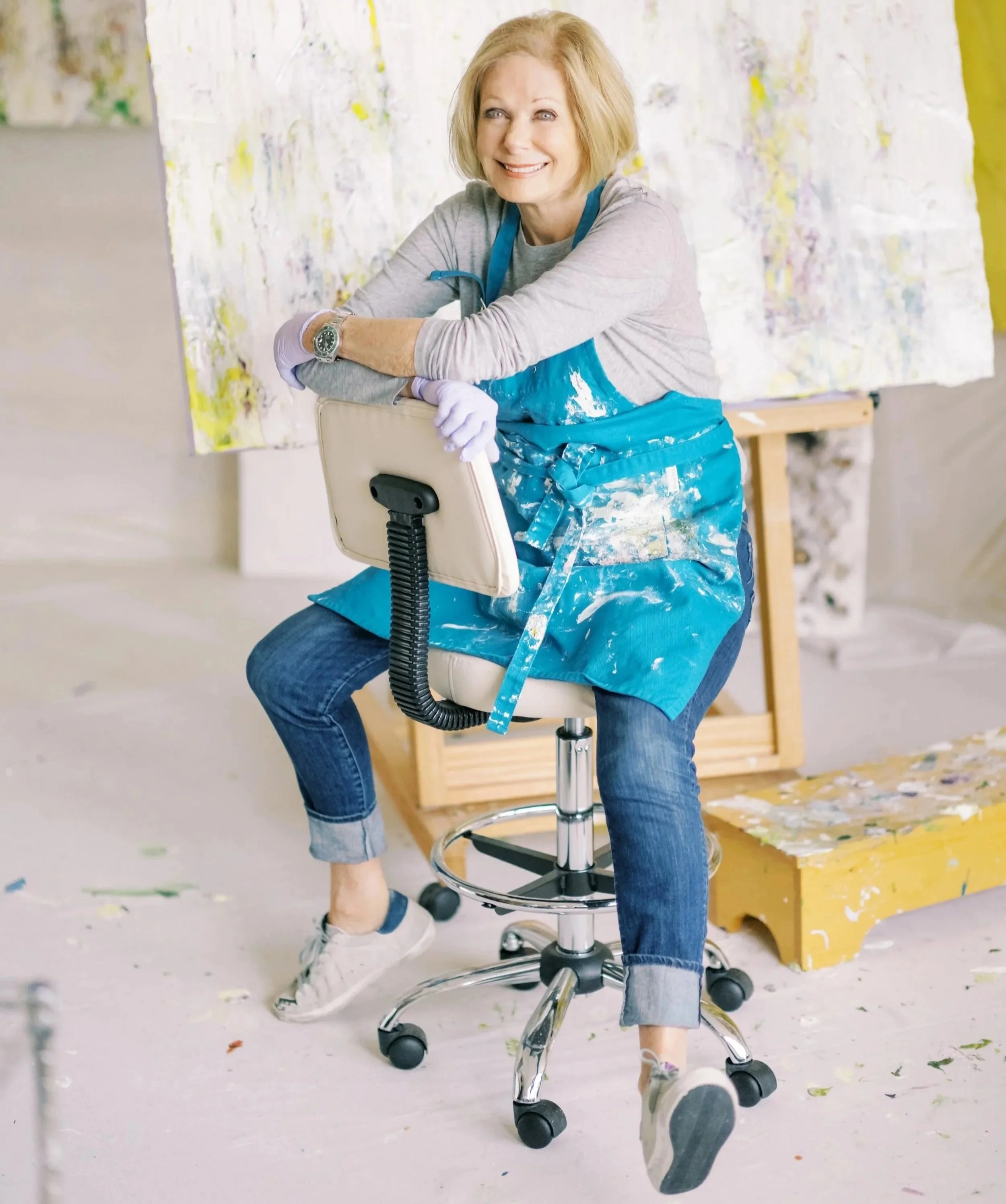 Artist Susan Swartz sitting in her art studio