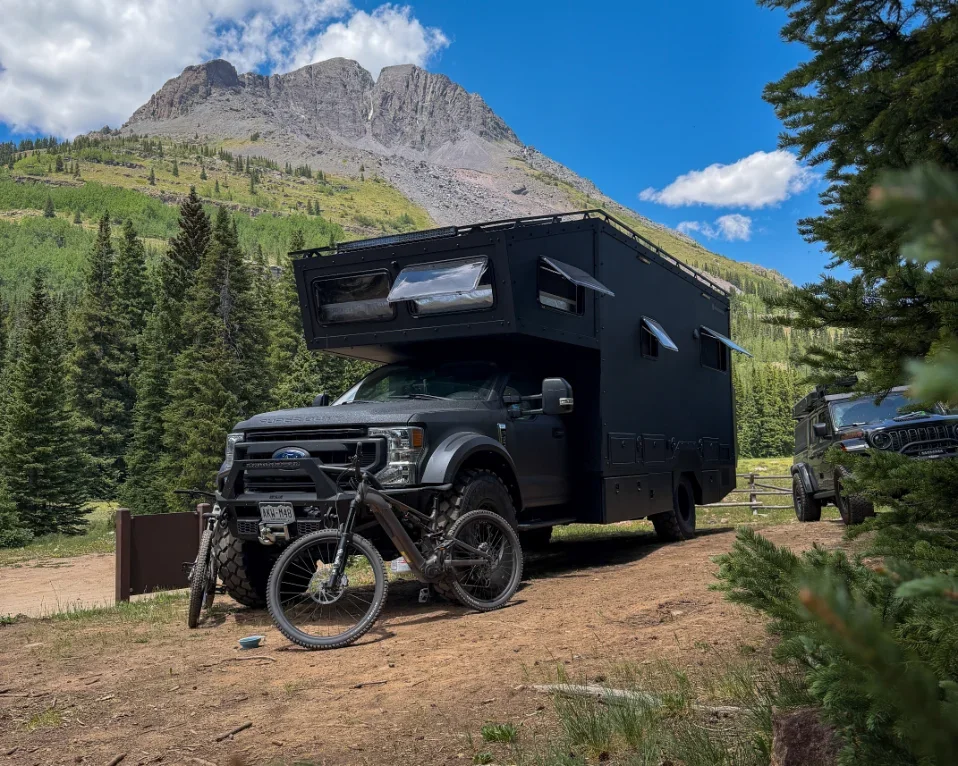 The Wanderbox expedition RV camped in the mountains