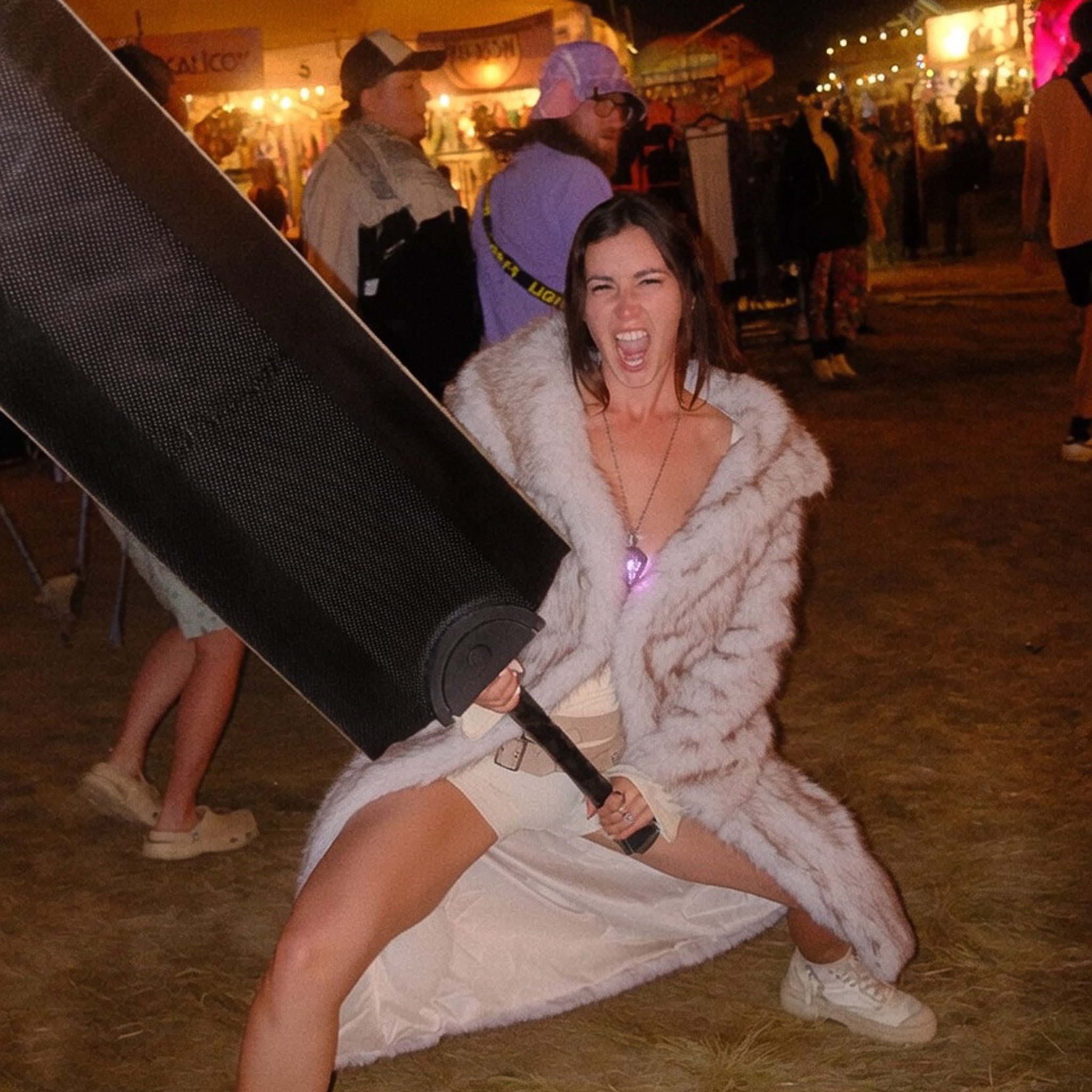Emma in a fur coat at a festival