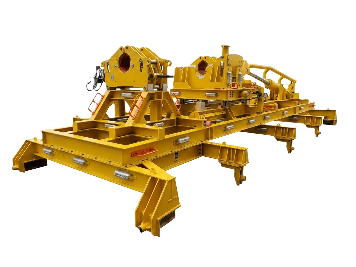A large yellow industrial machine used for construction or engineering work, featuring multiple components, panels, and hydraulic parts.