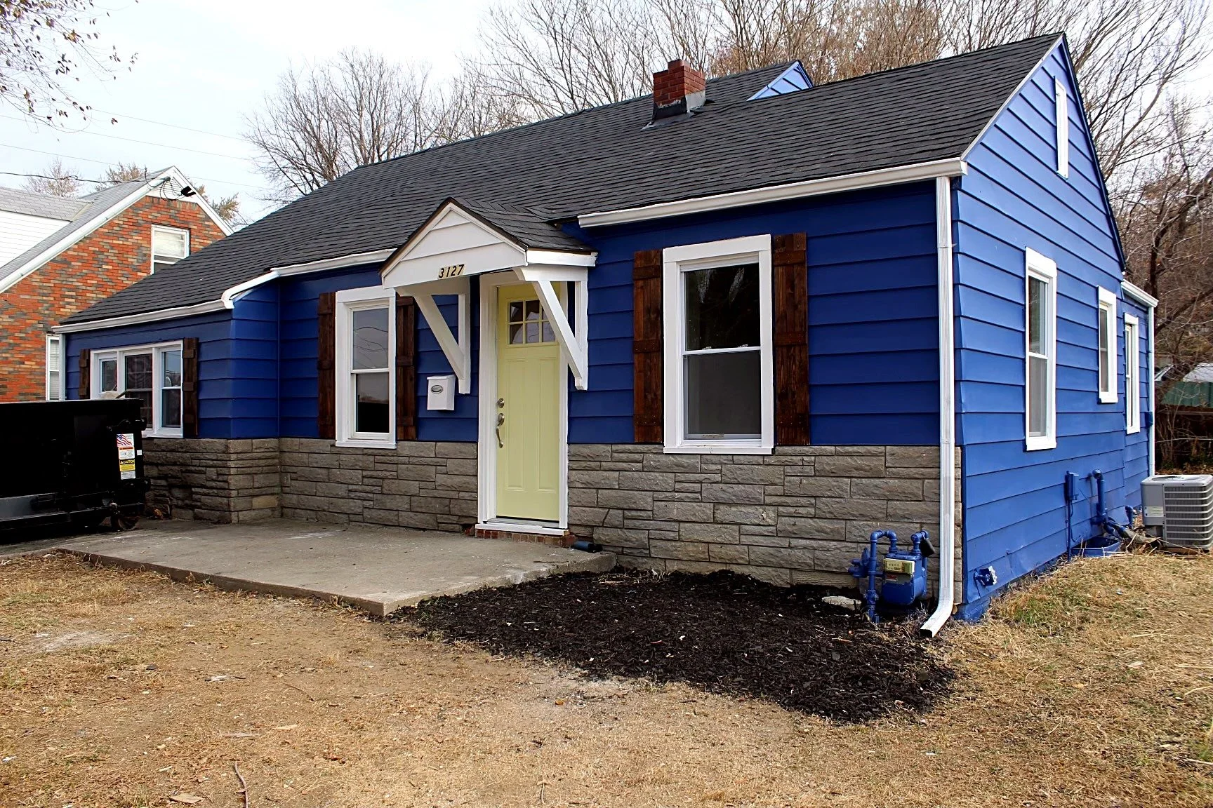 Exterior — new siding and stone veneer