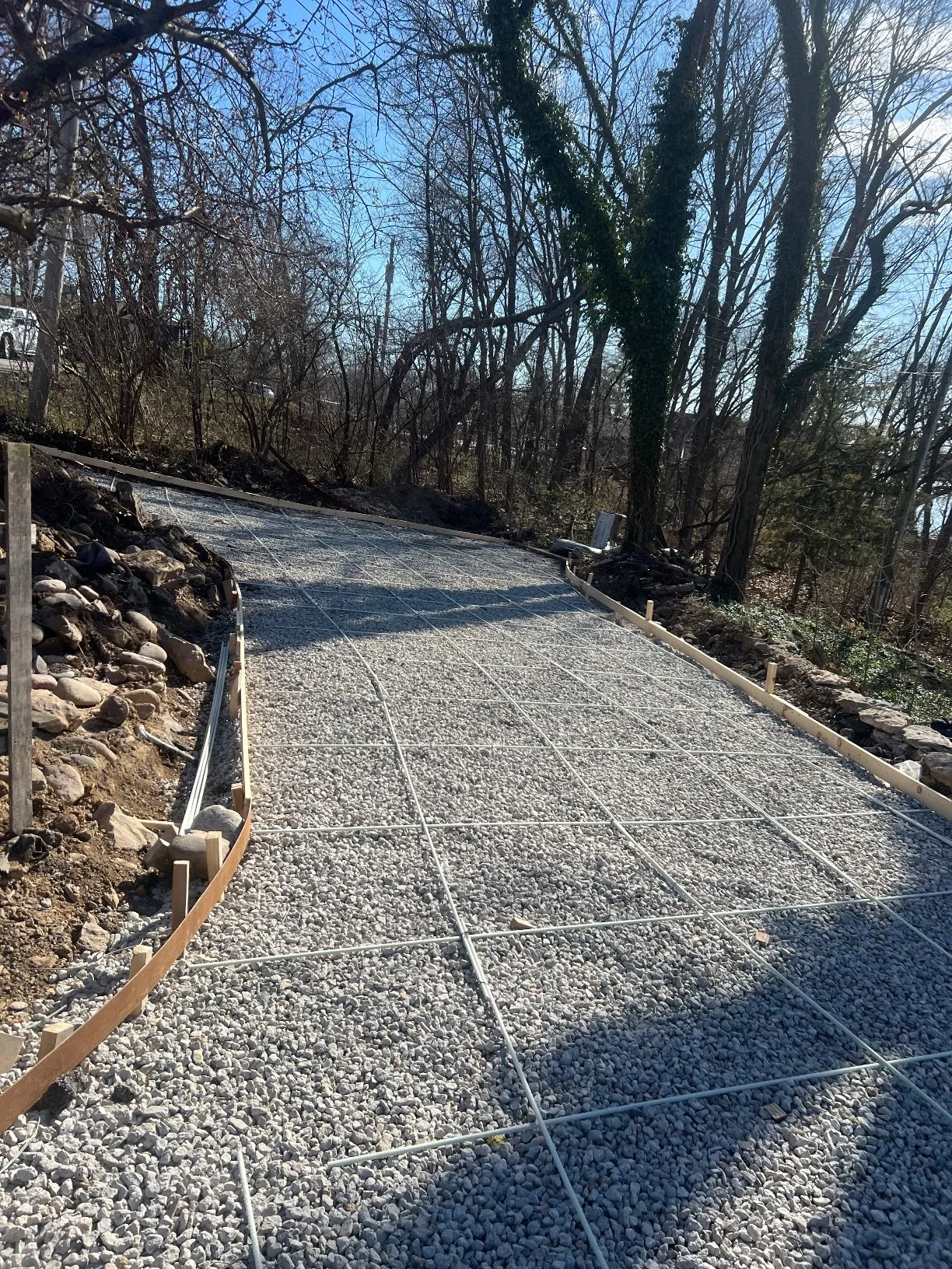 Prep — wooded lot, gravel and rebar