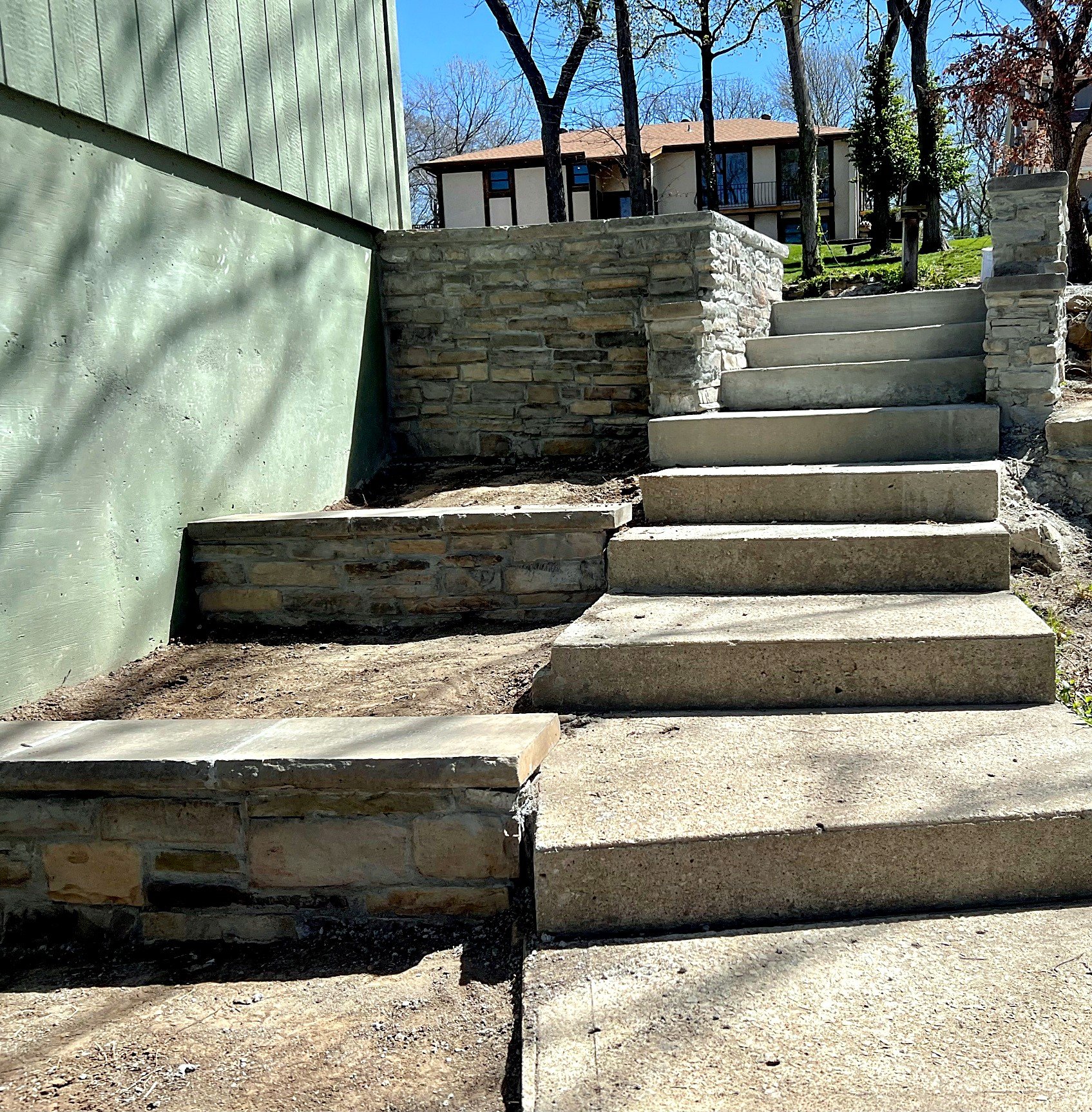 Finished — new steps, stone retaining walls