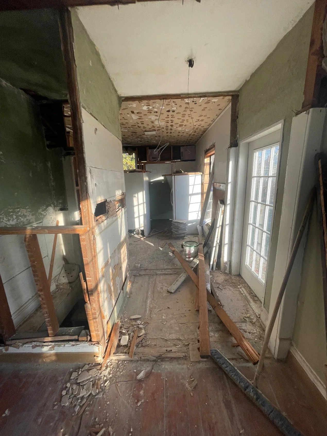 Hallway — gutted to the studs