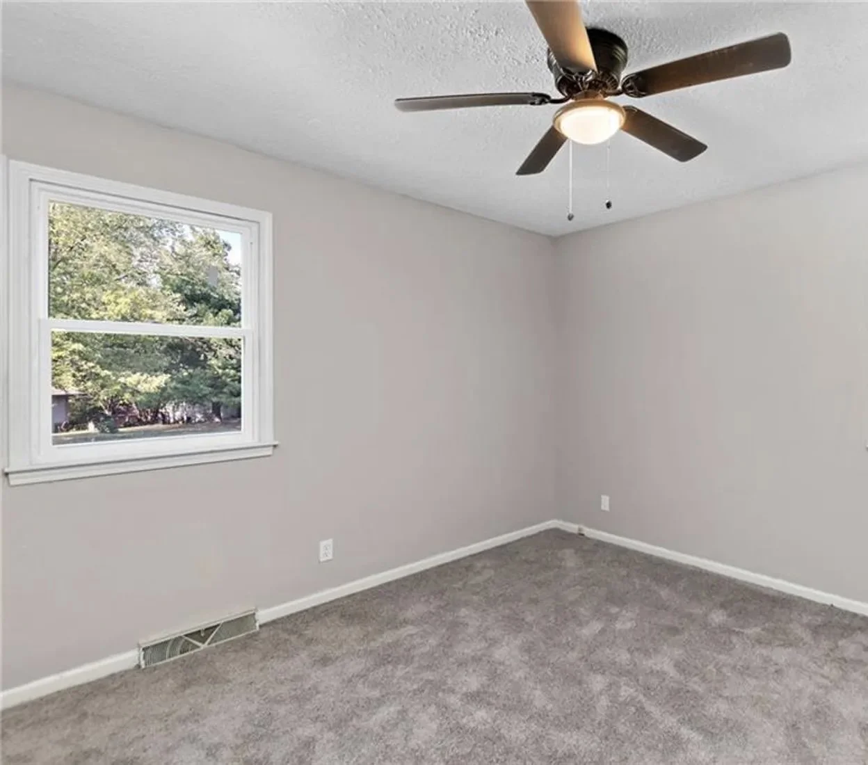 Bedroom — ceiling fan, fresh carpet