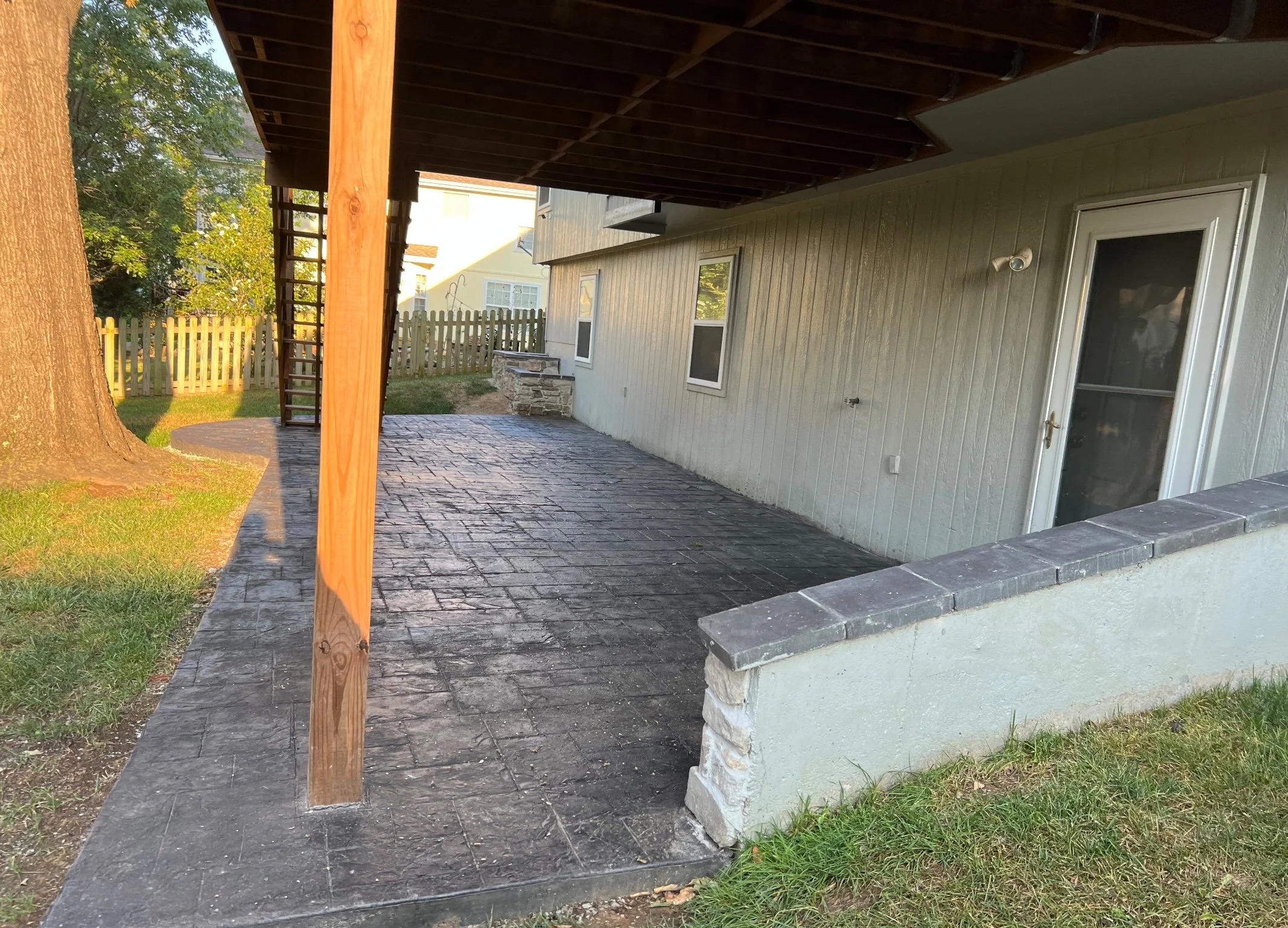 Patio and low wall, side view