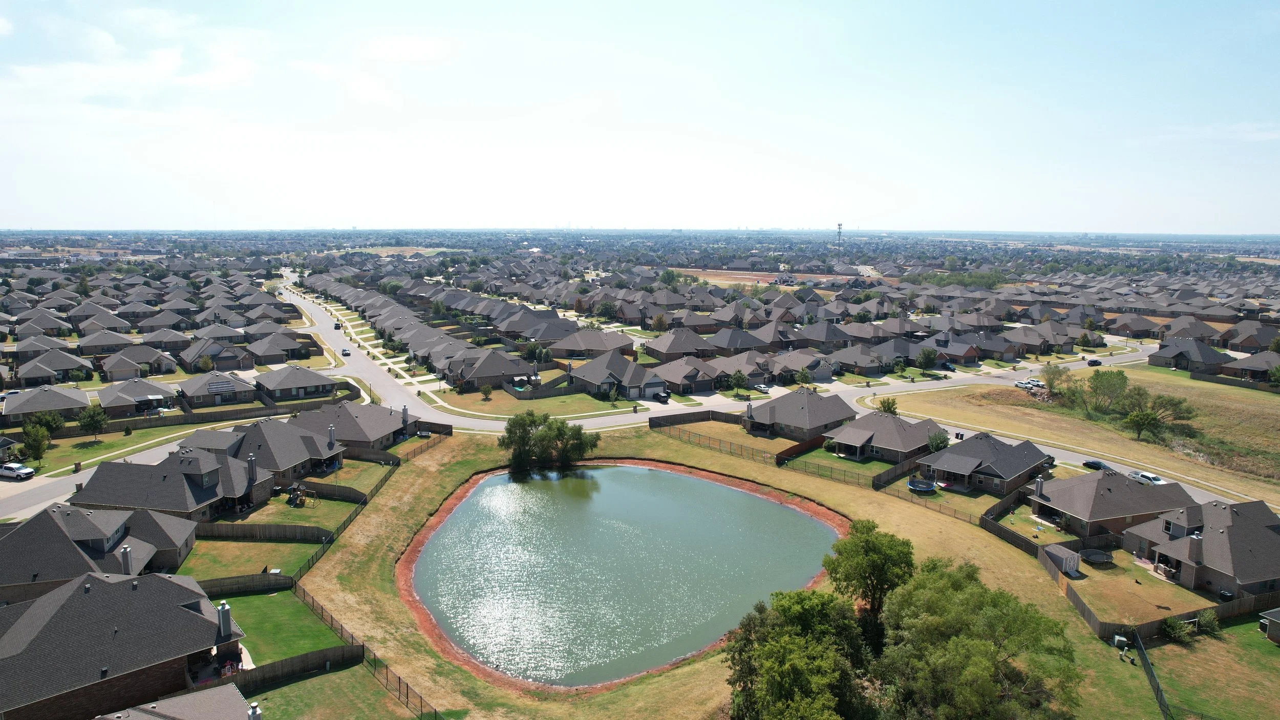 Drone aerial photography of an Edmond Oklahoma home and pond
