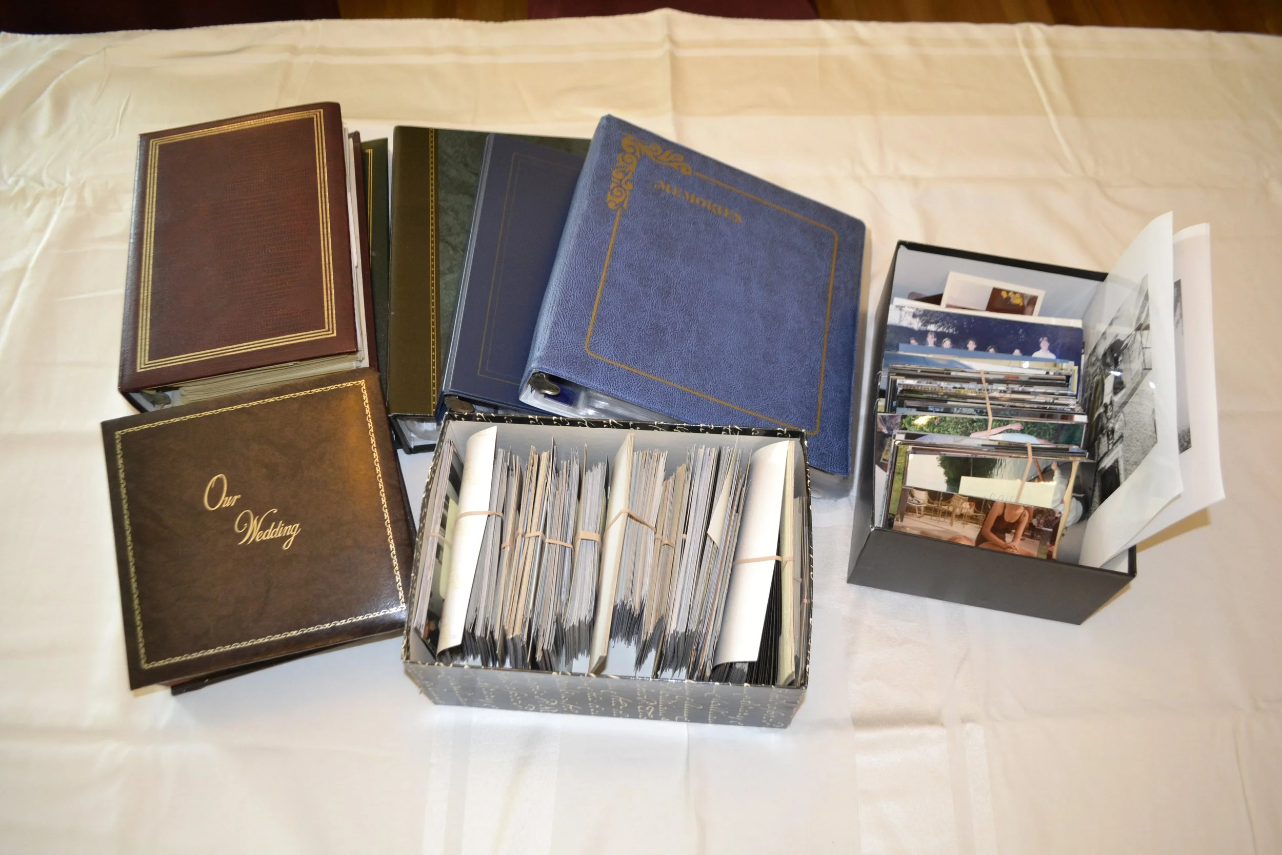 Before: Multiple old photo albums, plus boxes of loose print photos.