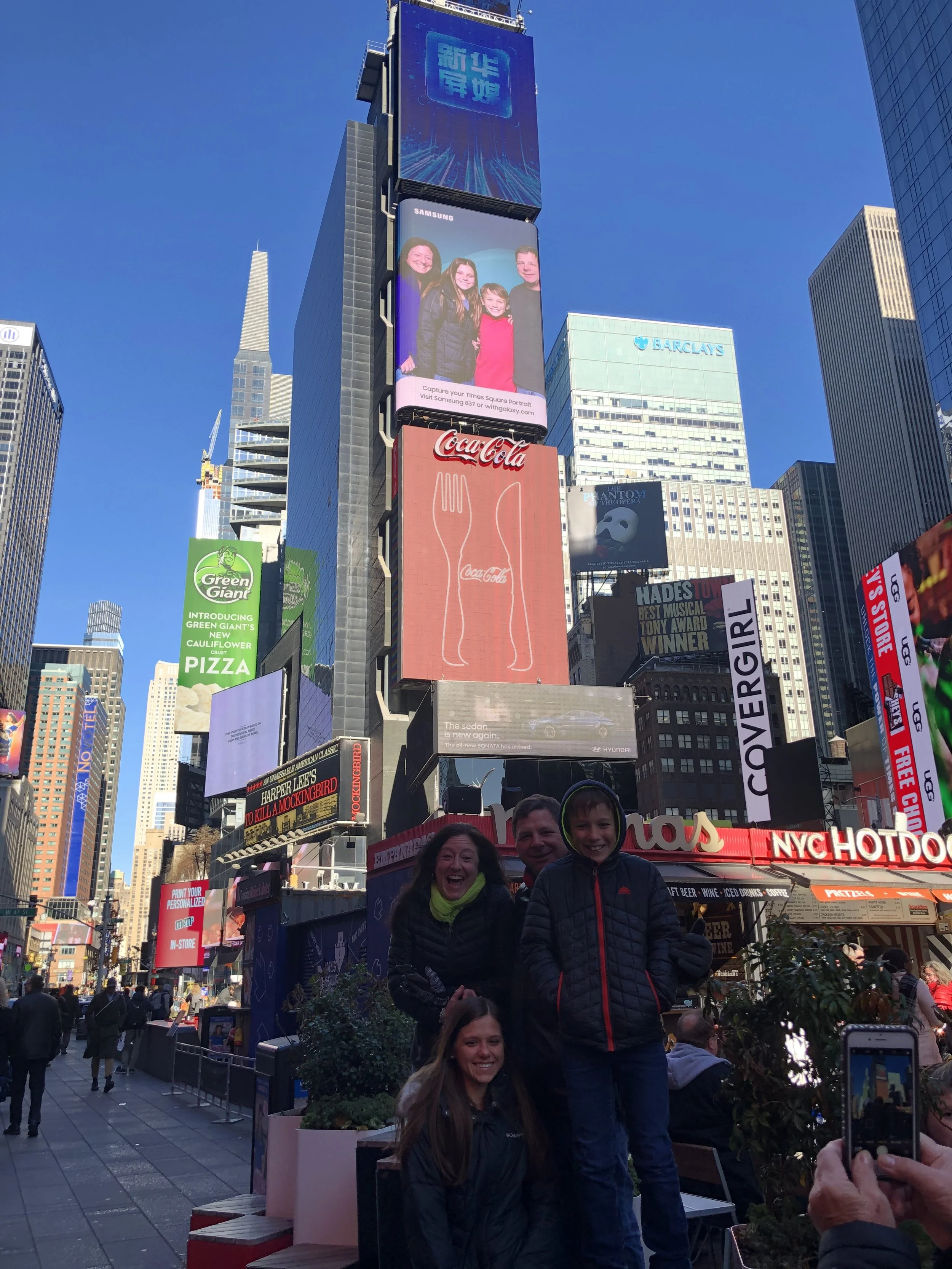 My family in front of our Times Square billboard.