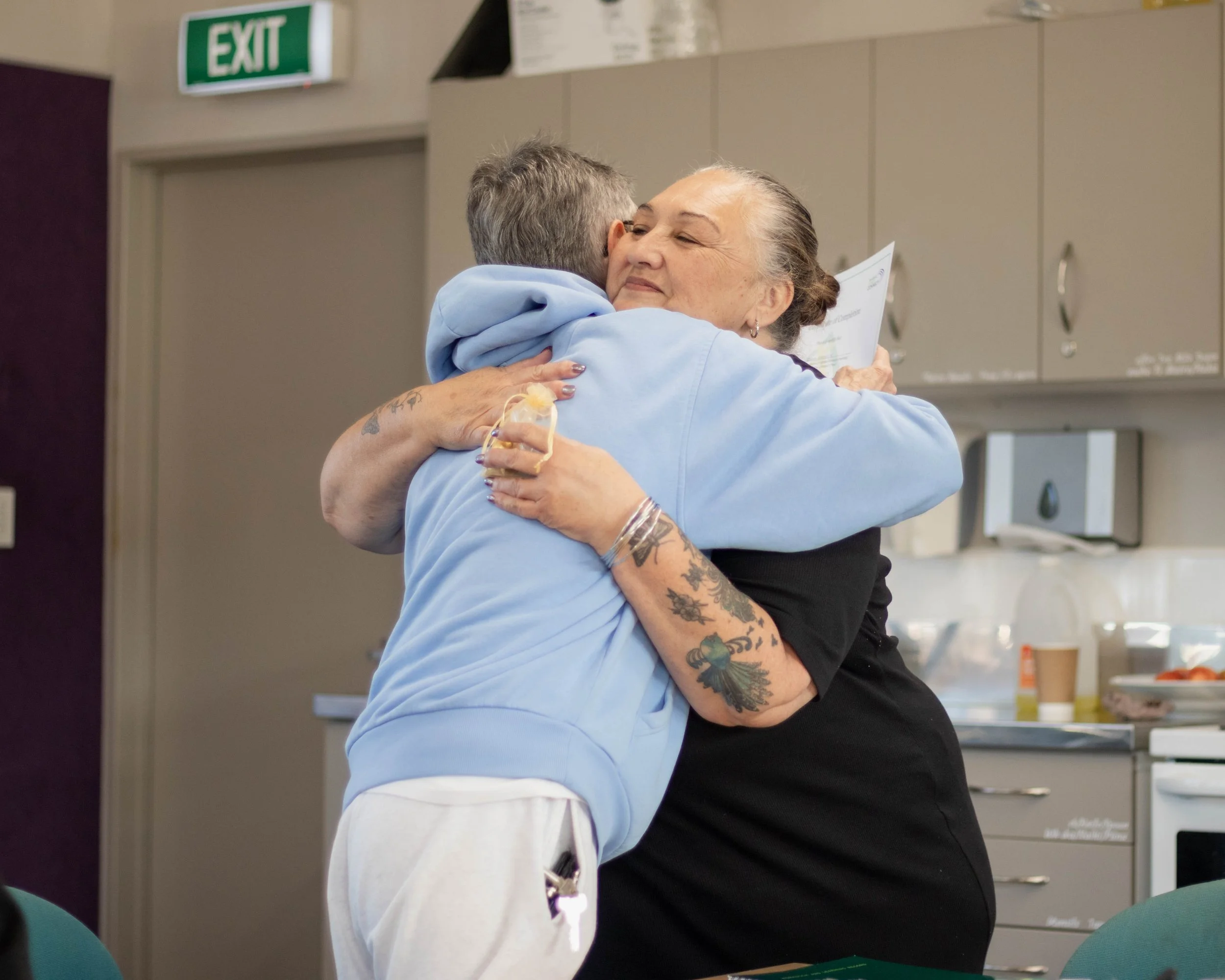 A Katoa Connect learner and community leader celebrating a programme milestone, reflecting the confidence, connection, and support fostered through digital inclusion.