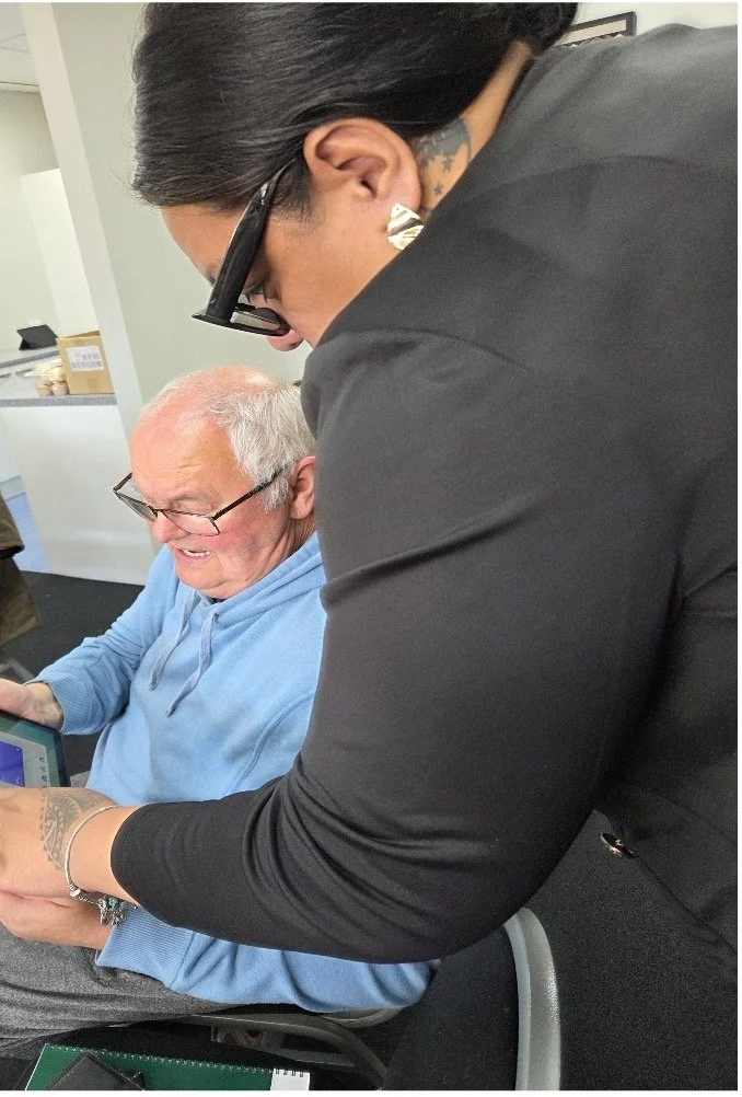 Success Stories: A facilitator supports Michael Dargan as he learns to use a tablet during the Kaumātua Senior Connect programme.