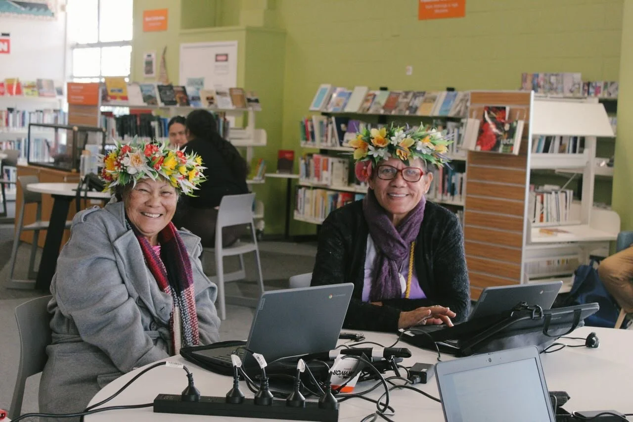 Katoa Connect learners at Māngere Town Centre Library using laptops during a digital skills programme, building confidence and staying connected through technology in a welcoming community space.