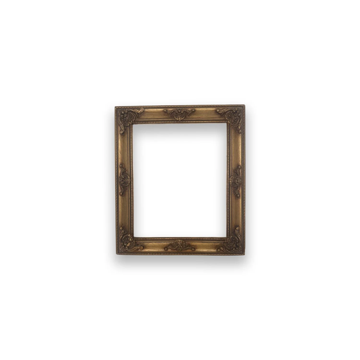 Empty ornate gold picture frame against a white background.