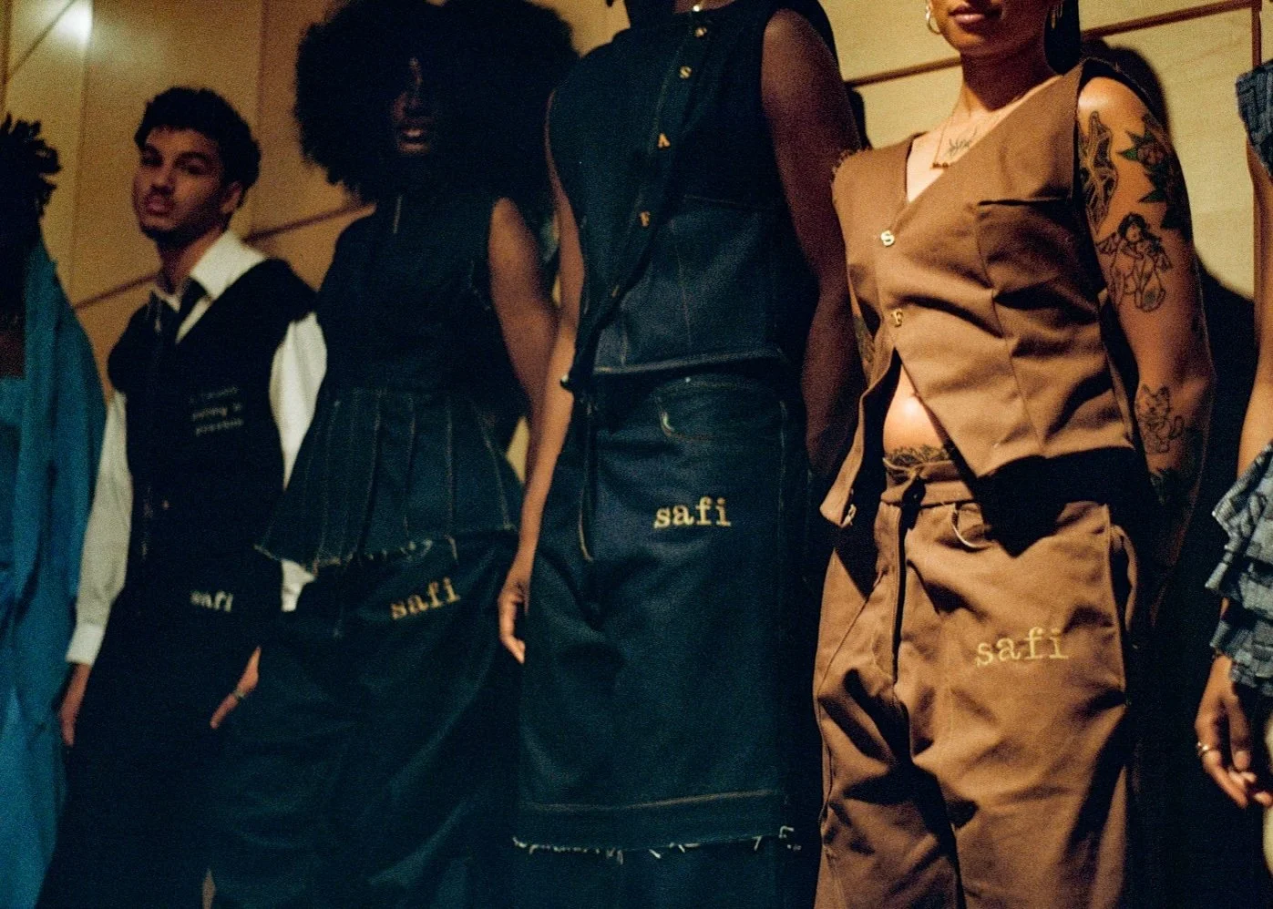 Close-up of mannequins dressed in trendy clothing with using bold fabrics and accessories, in a retail or display setting.