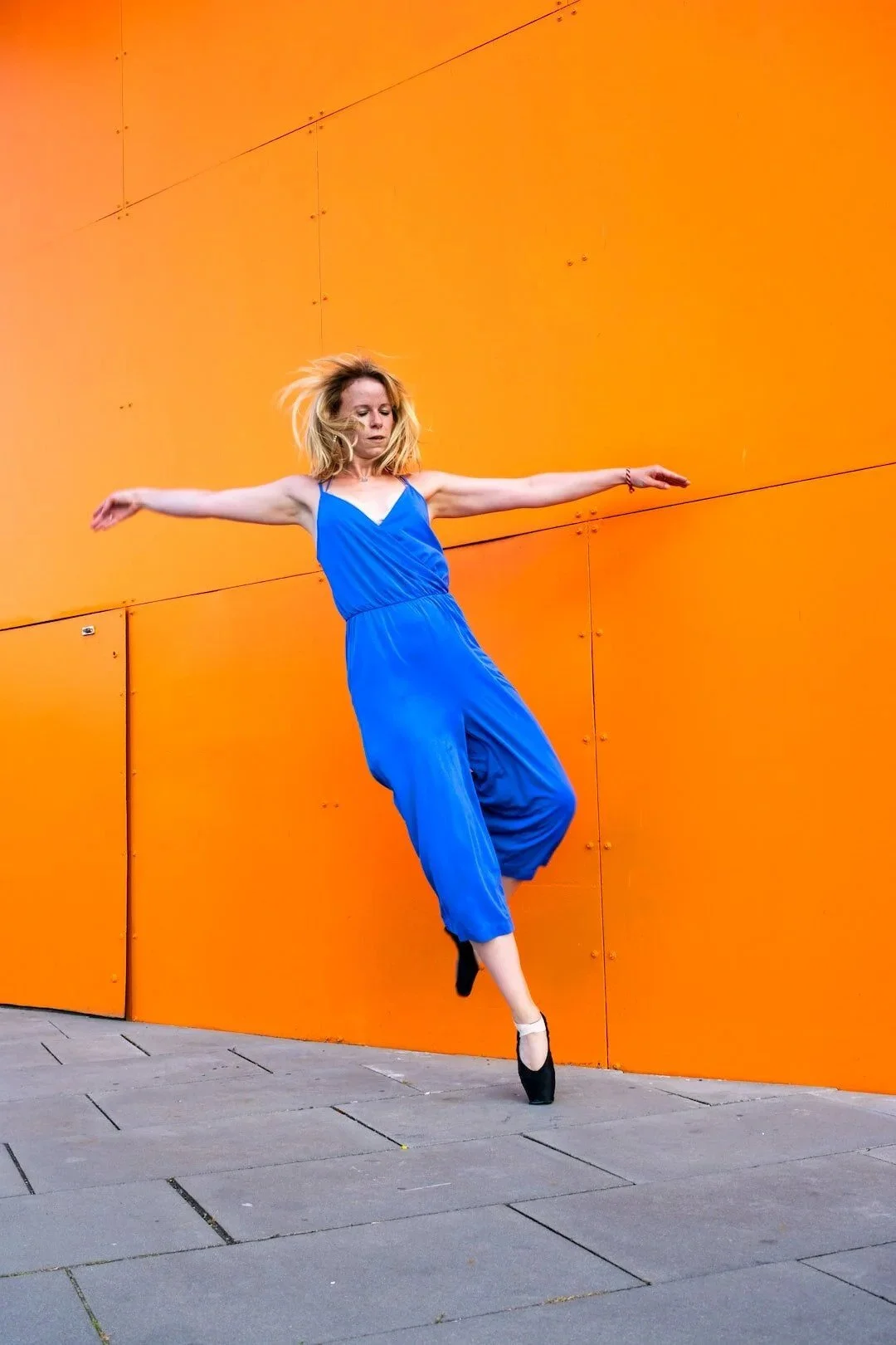embody-alchemy-dancer-in-air-blue-jumpsuit.jpg