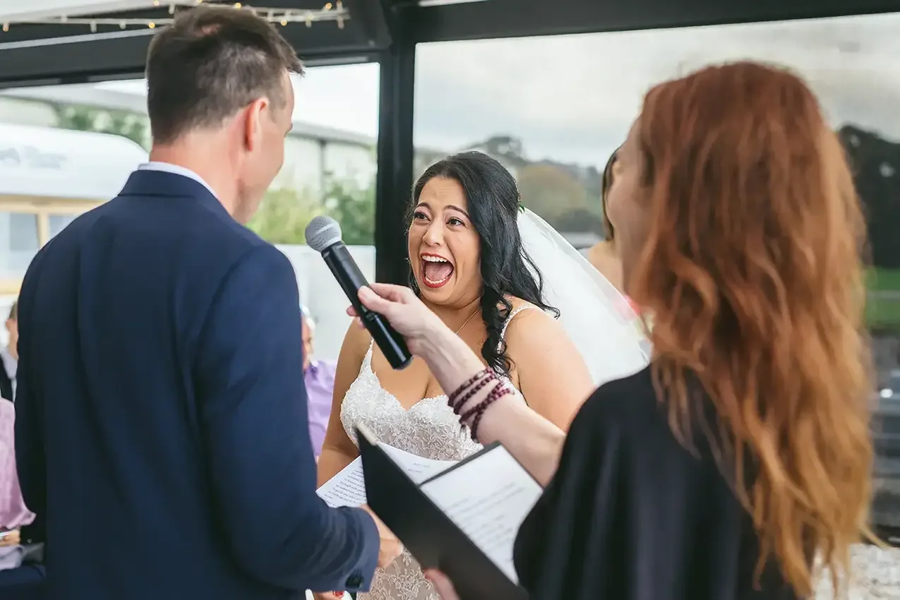 Wedding ceremony moment of couple laughing